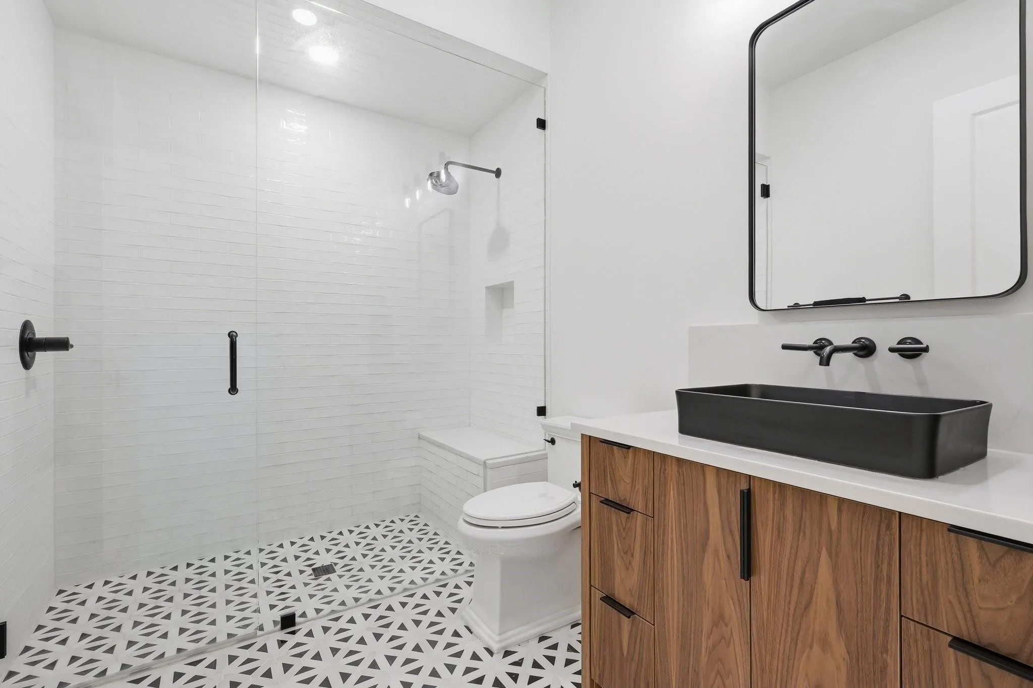 The Ensuite Bath offers a zero-entry shower, a thoughtful touch for accessibility and aging in place.