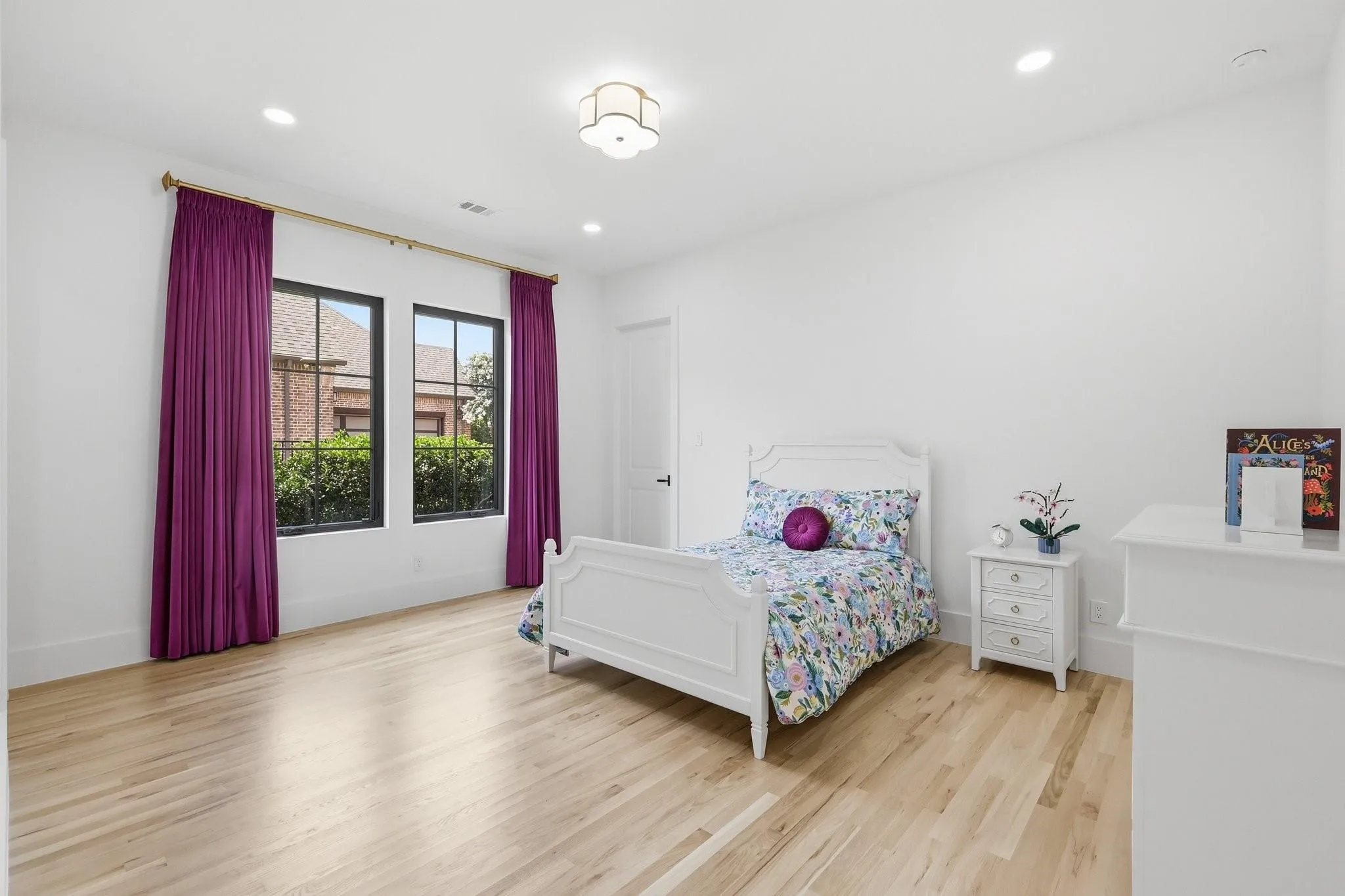 Secondary bedroom large enough for a king bed with an ensuite bathroom and walk in closet.