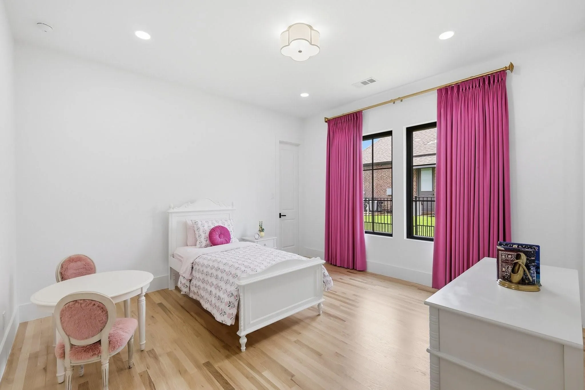 The second generously sized Secondary Bedroom offers a spacious walk-in closet with custom built-in organization.