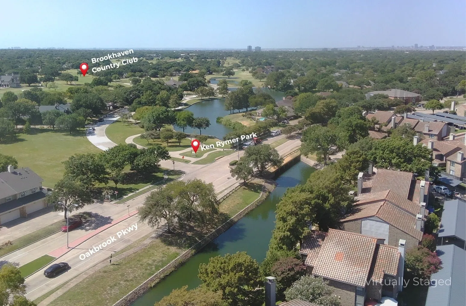 view of Oakbrook Pkwy, creek, pond and walking trails