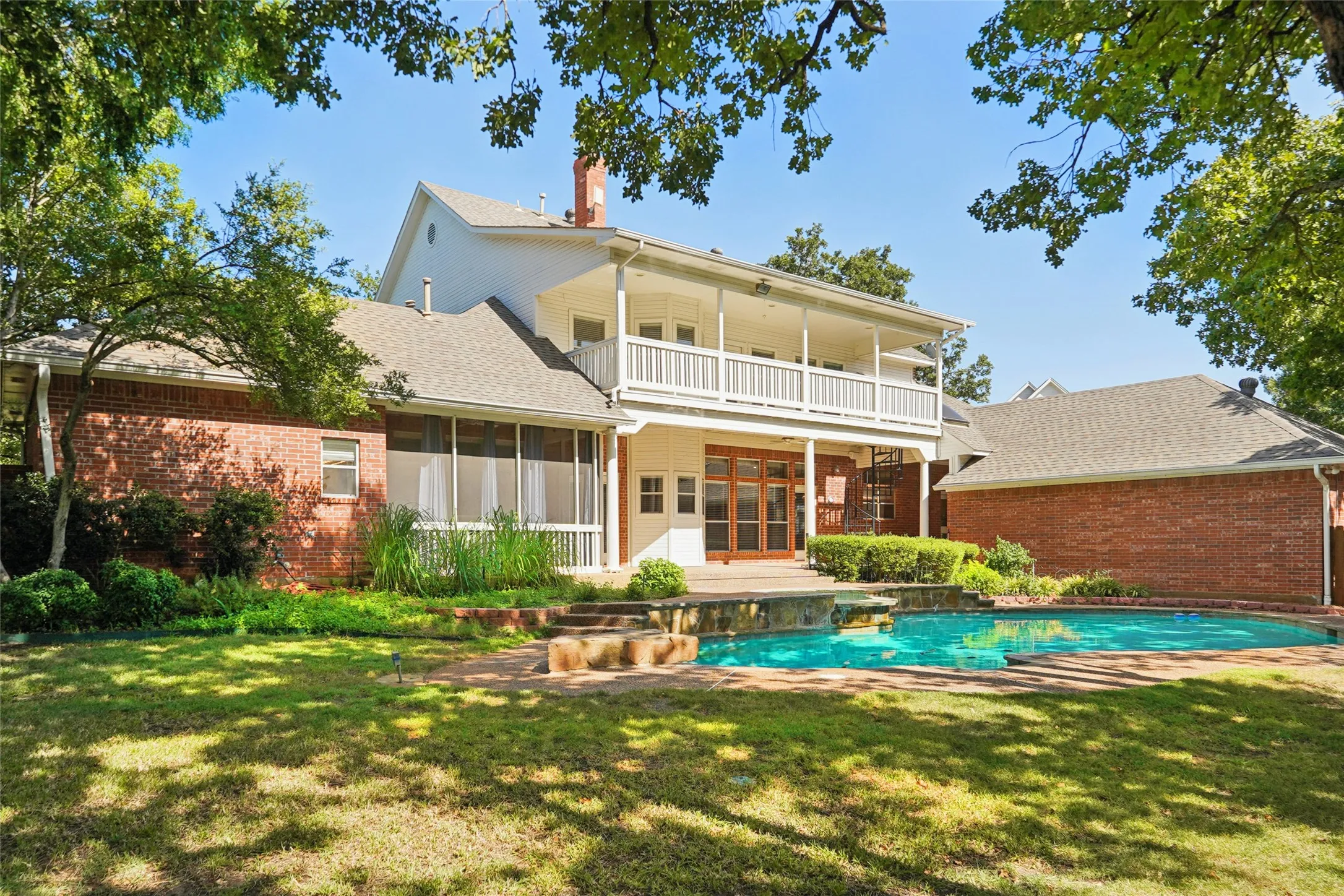 Brick exterior with a second-story balcony