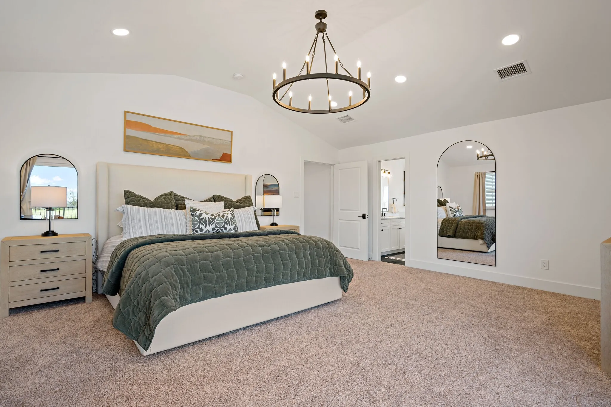 Vaulted ceiling with an ornate chandelier, recessed lighting, and soft carpet flooring