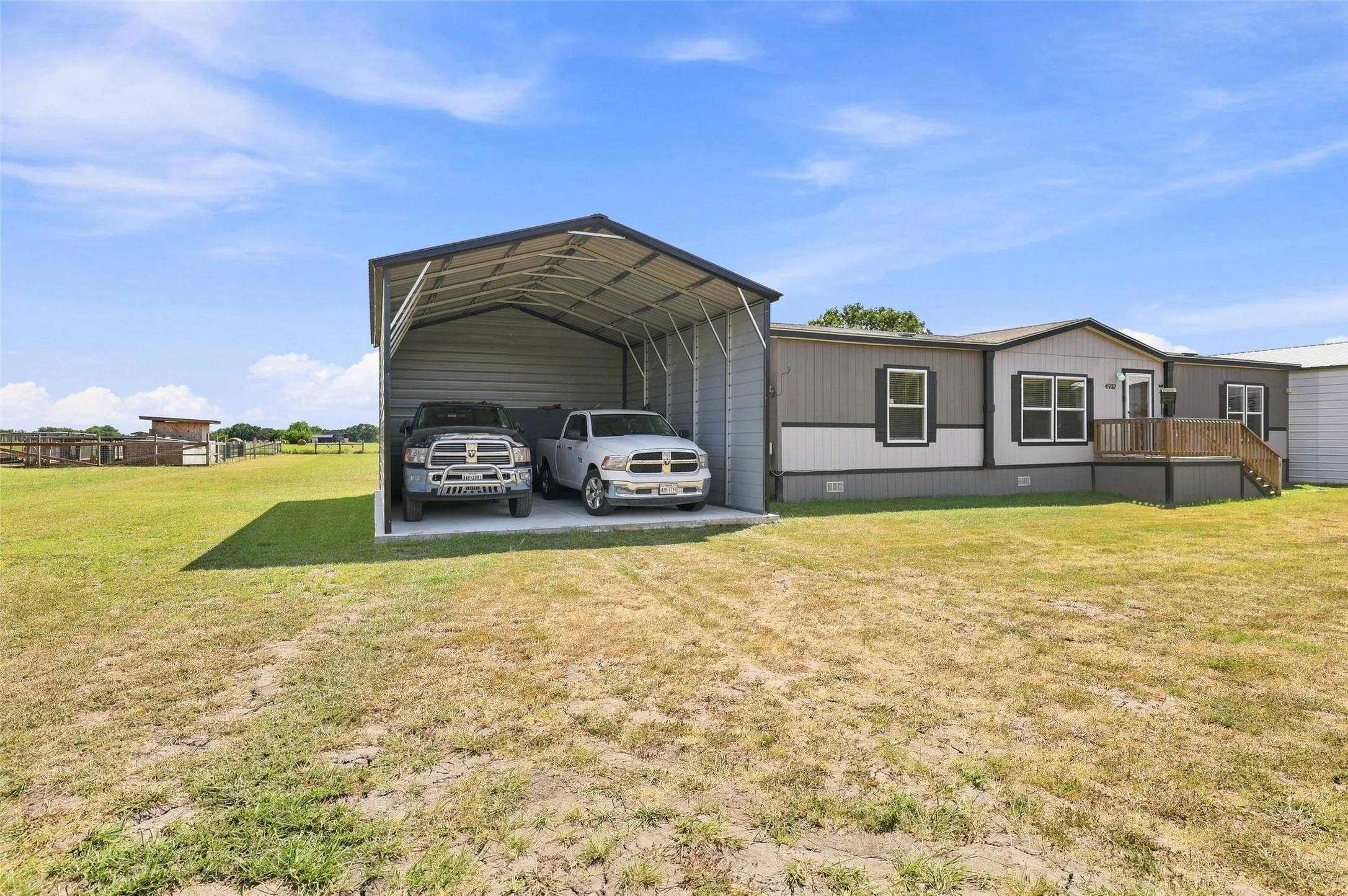 Plenty of room in the 20x30 open garage to park two big trucks