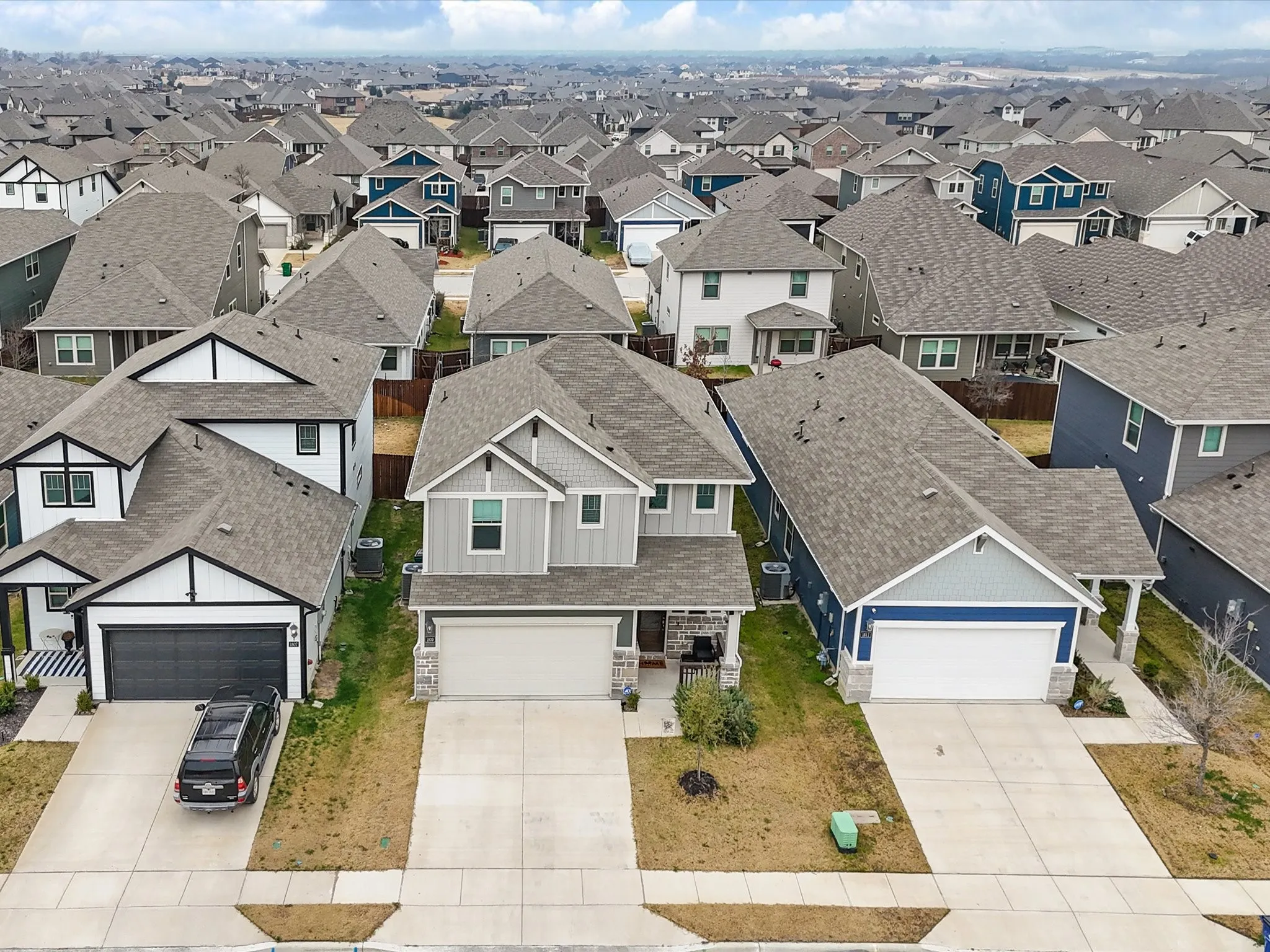 Contemporary residential architecture, attached garages, and concrete driveways
