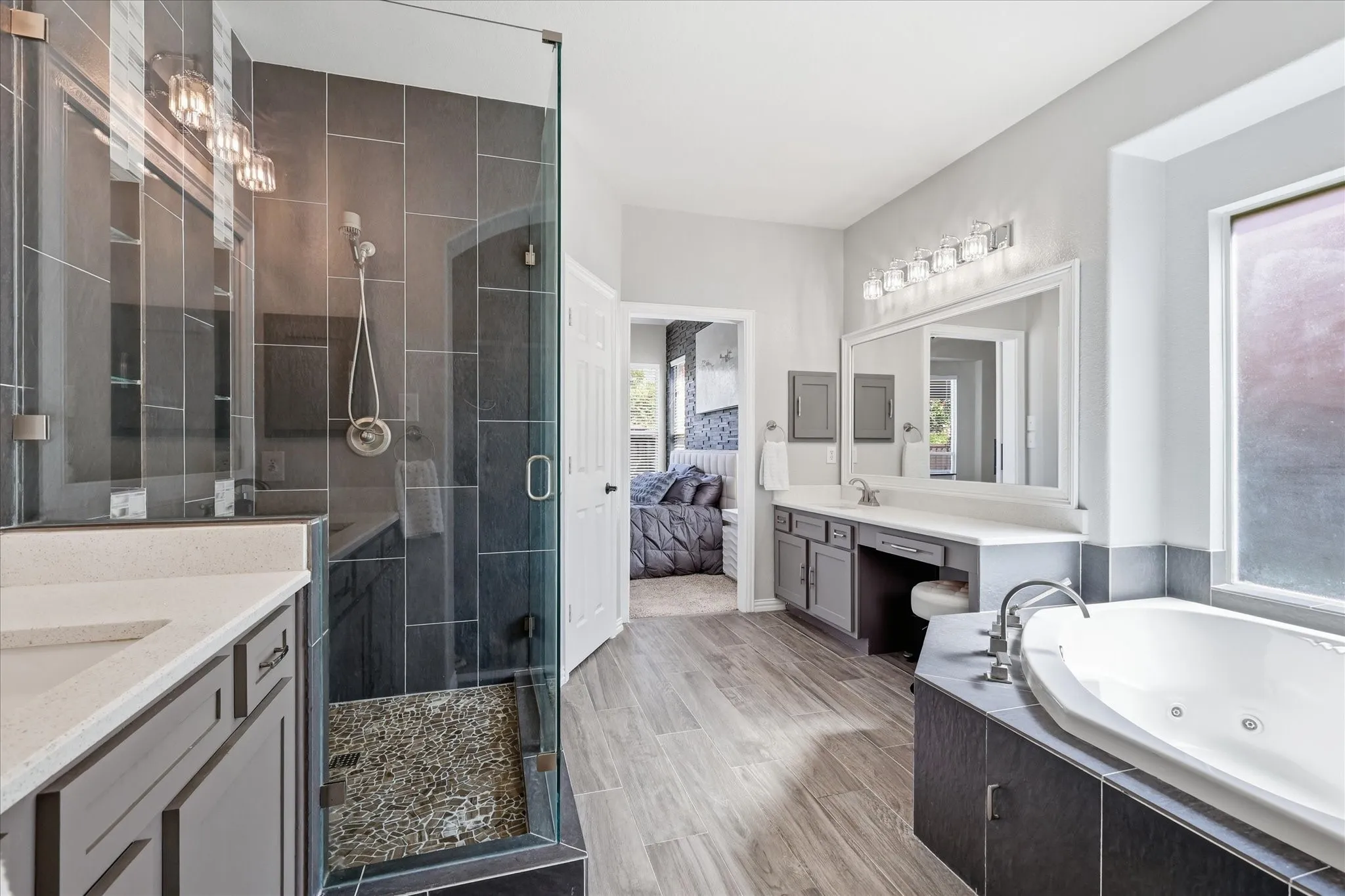 Dual vanities, framed mirrors and a jetted tub