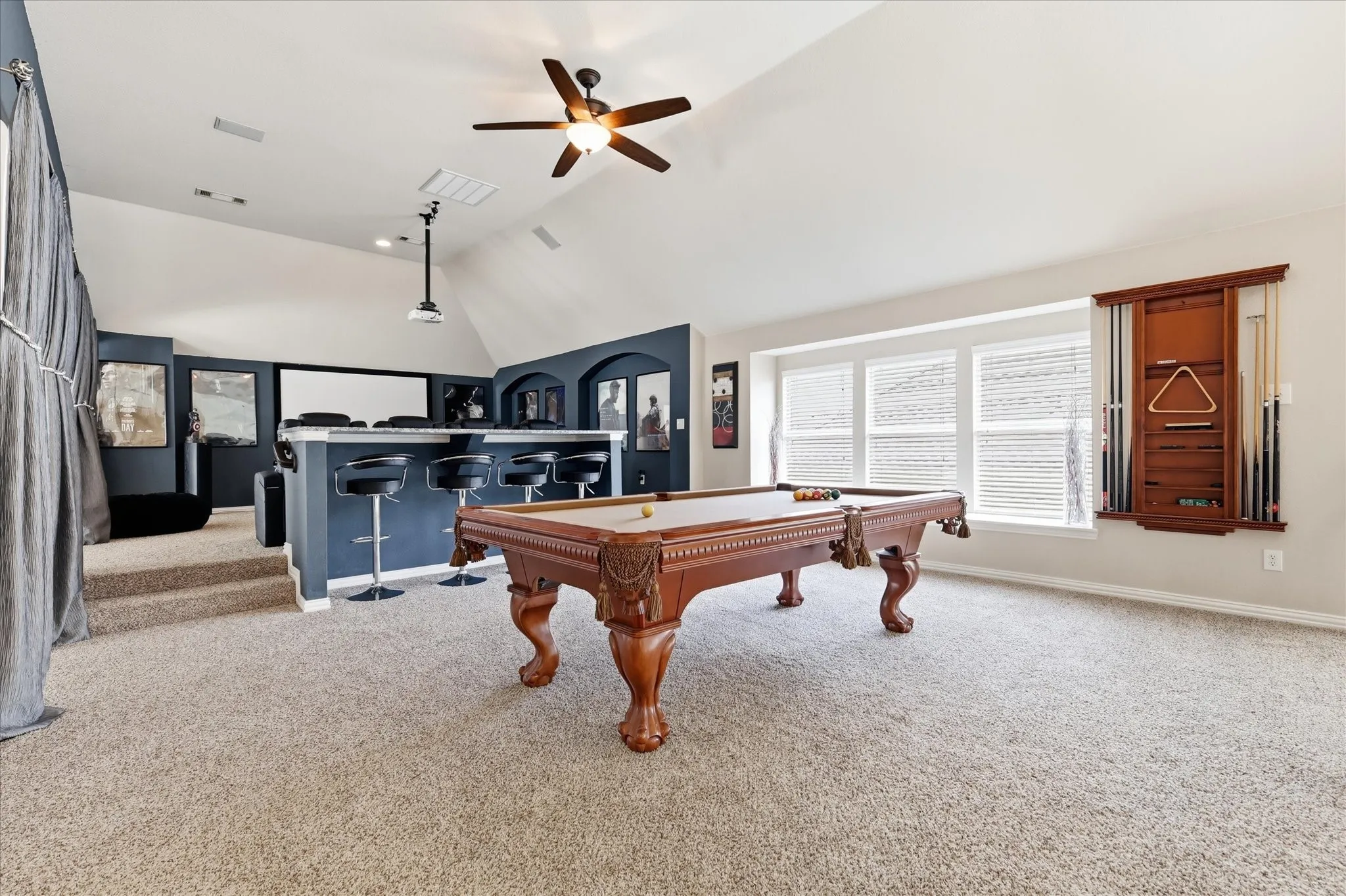 Game room area looks to media room