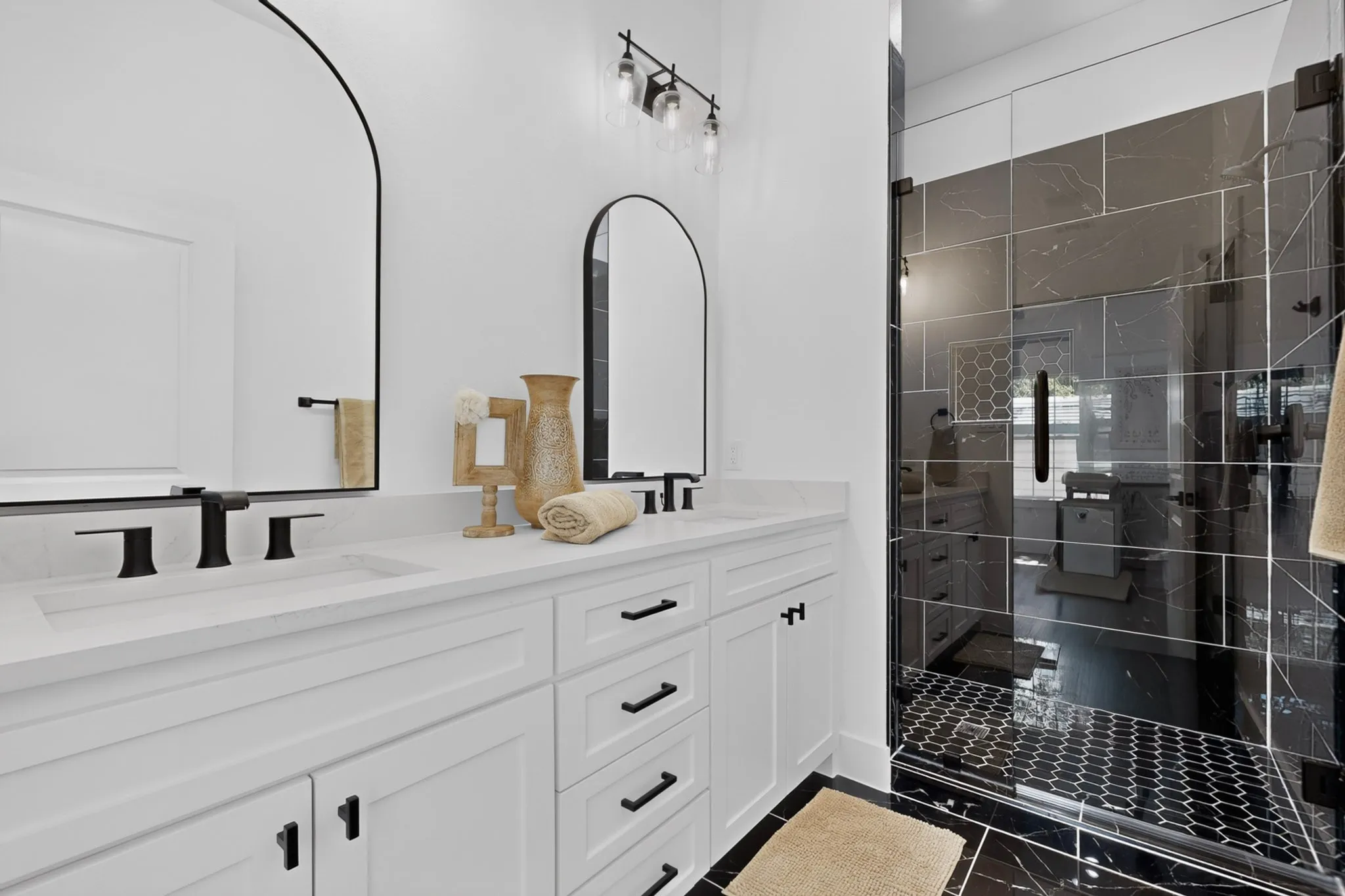 Dual vanity with white cabinetry and integrated sinks
