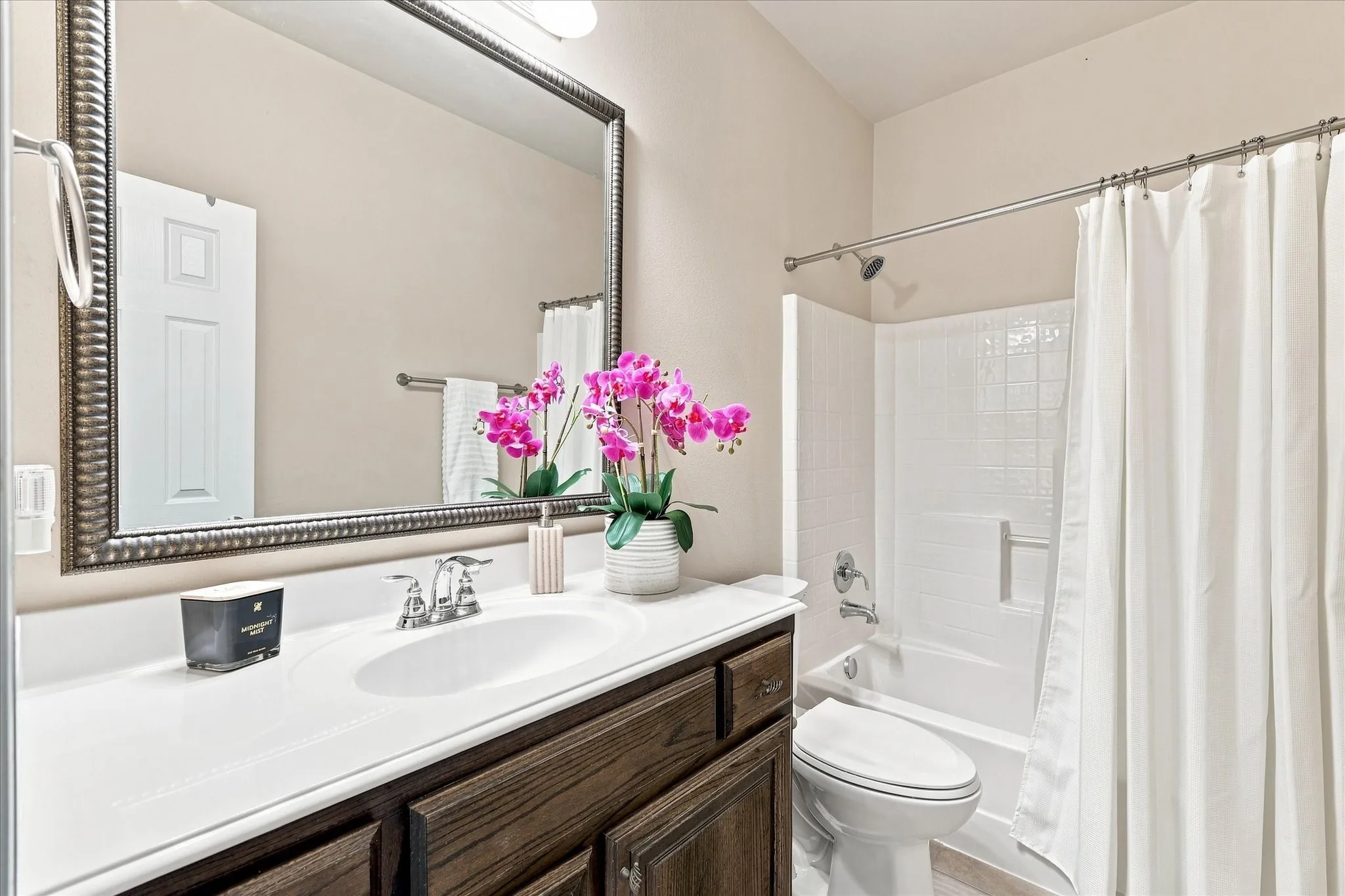 Centrally located for easy access from the secondary bedroom and main living areas, the secondary bathroom is perfectly positioned to accommodate both guests and everyday living.