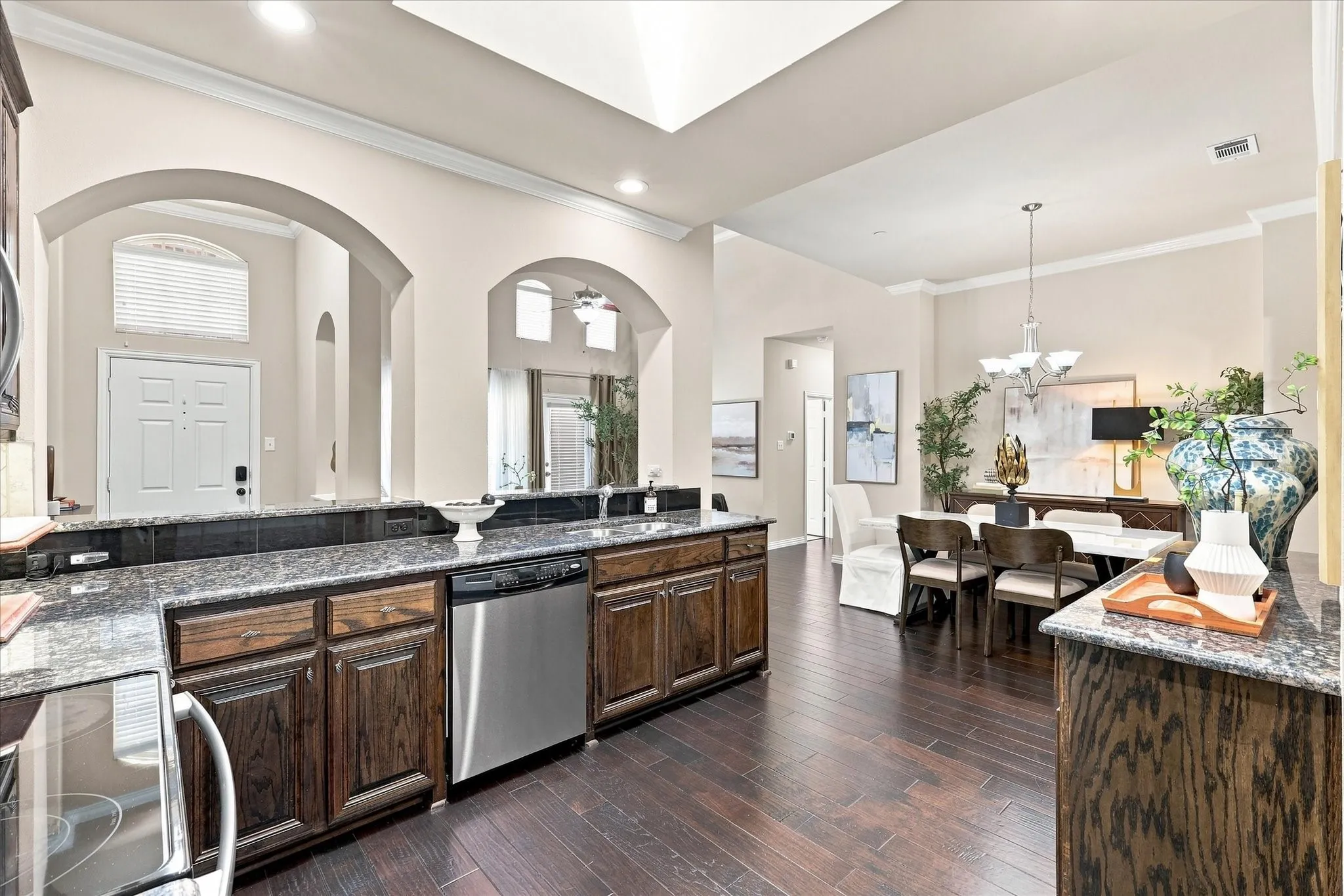 A well-appointed kitchen showcases granite countertops, stainless steel appliances, and generous cabinet space, providing plenty of room for cooking, storage, and entertaining.