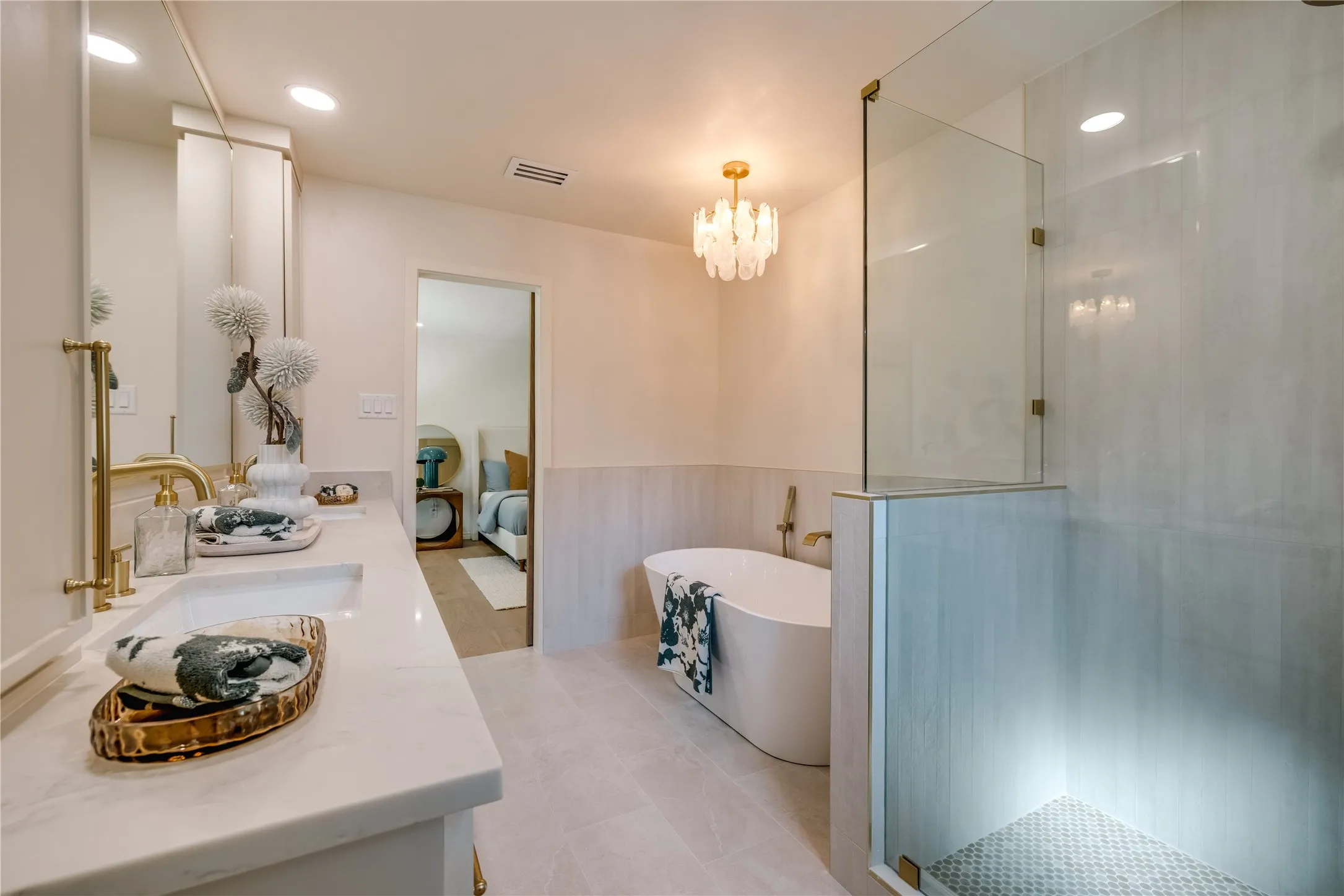 Primary Bathroom featuring a decorative chandelier