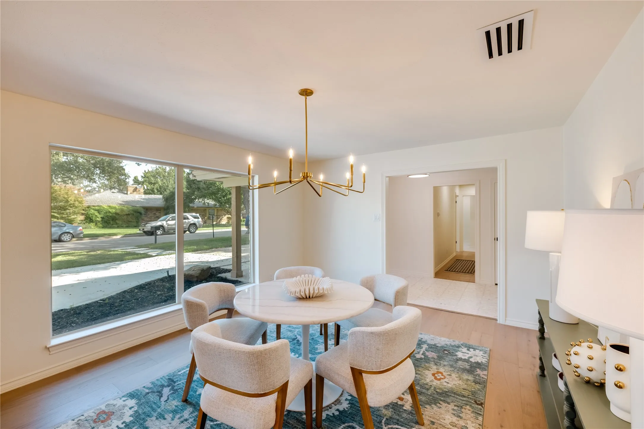 Front facing dining area and a large picture window