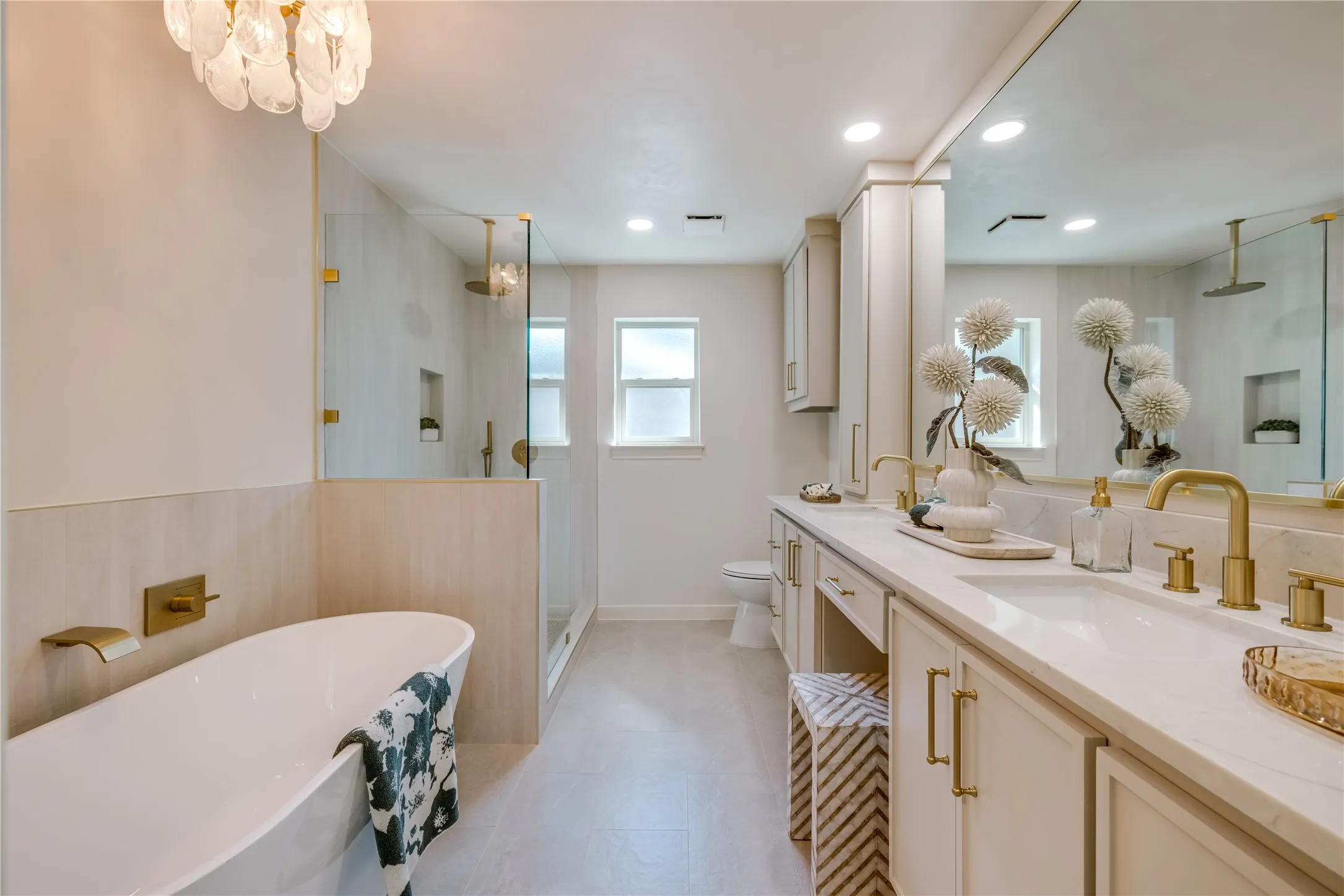 Primary Bathroom featuring a decorative chandelier