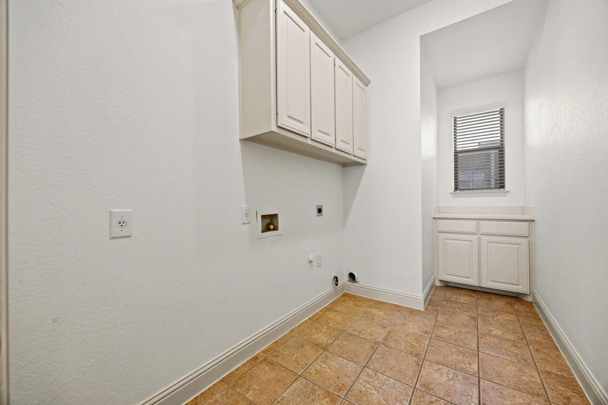 Laundry room built-in desk and cabinets