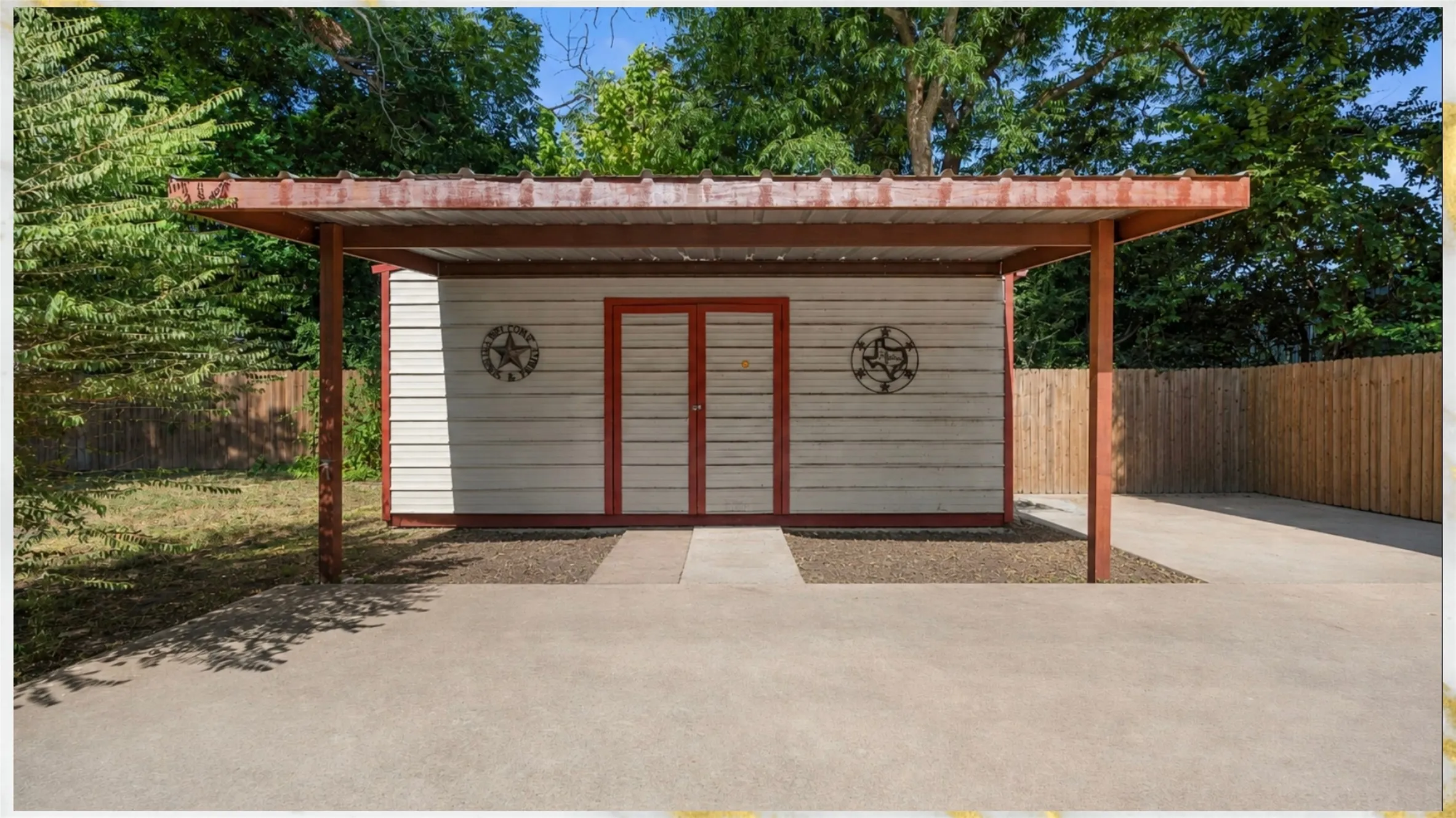 Detached structure with a covered entry, horizontal siding, and a concrete pathway