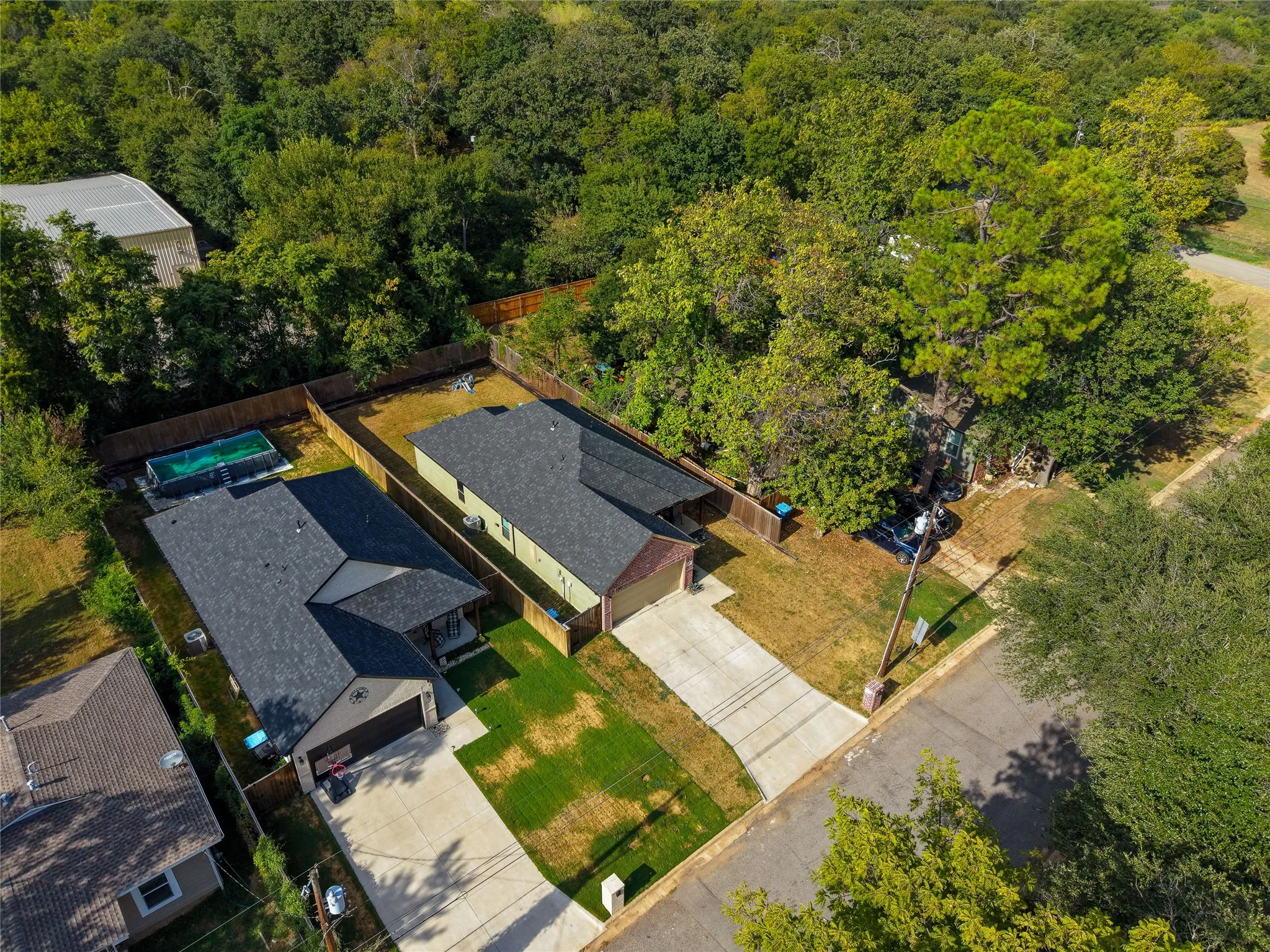 The home is surrounded by trees and feels more private