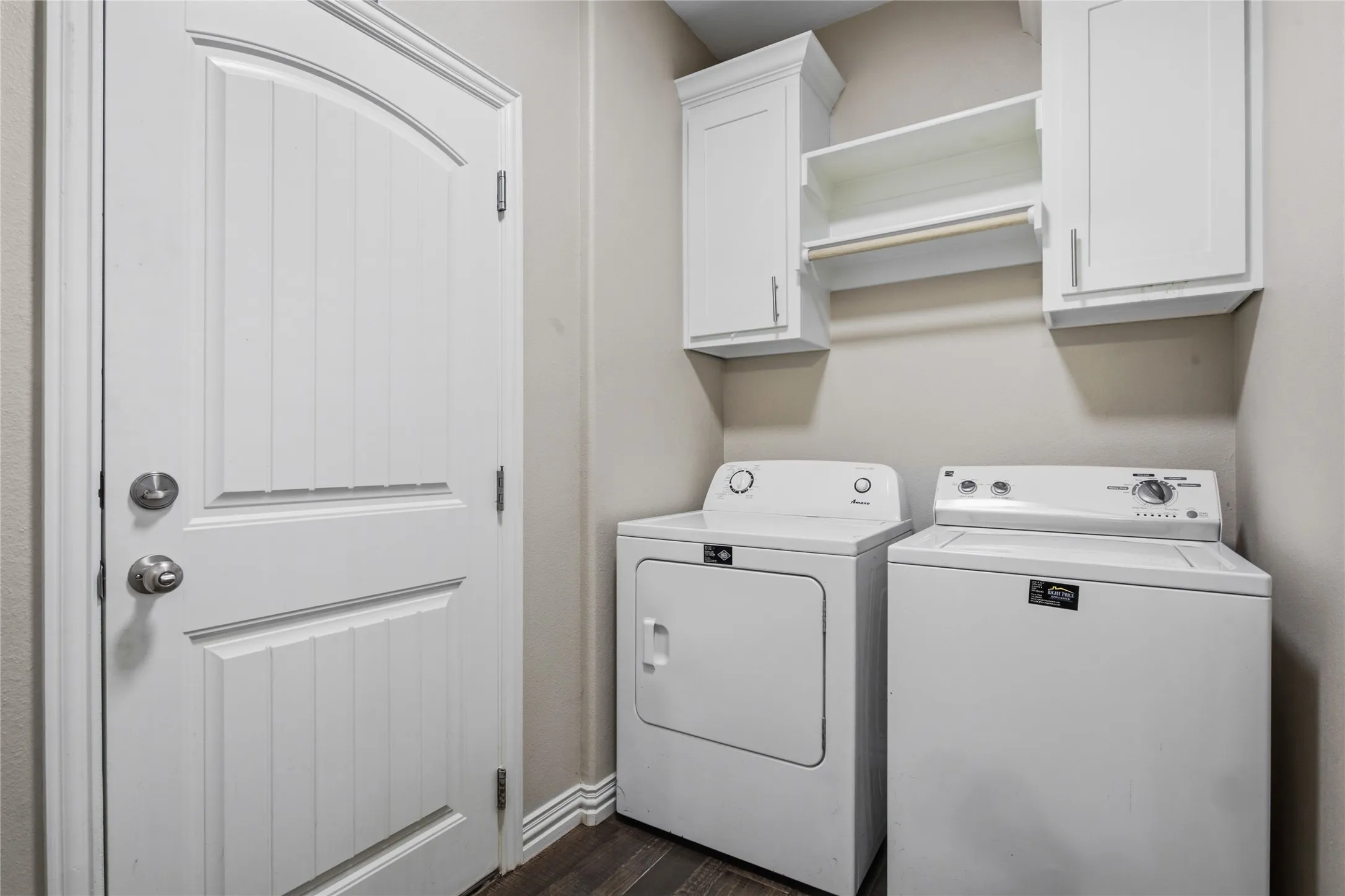 Laundry room with upper cabinets