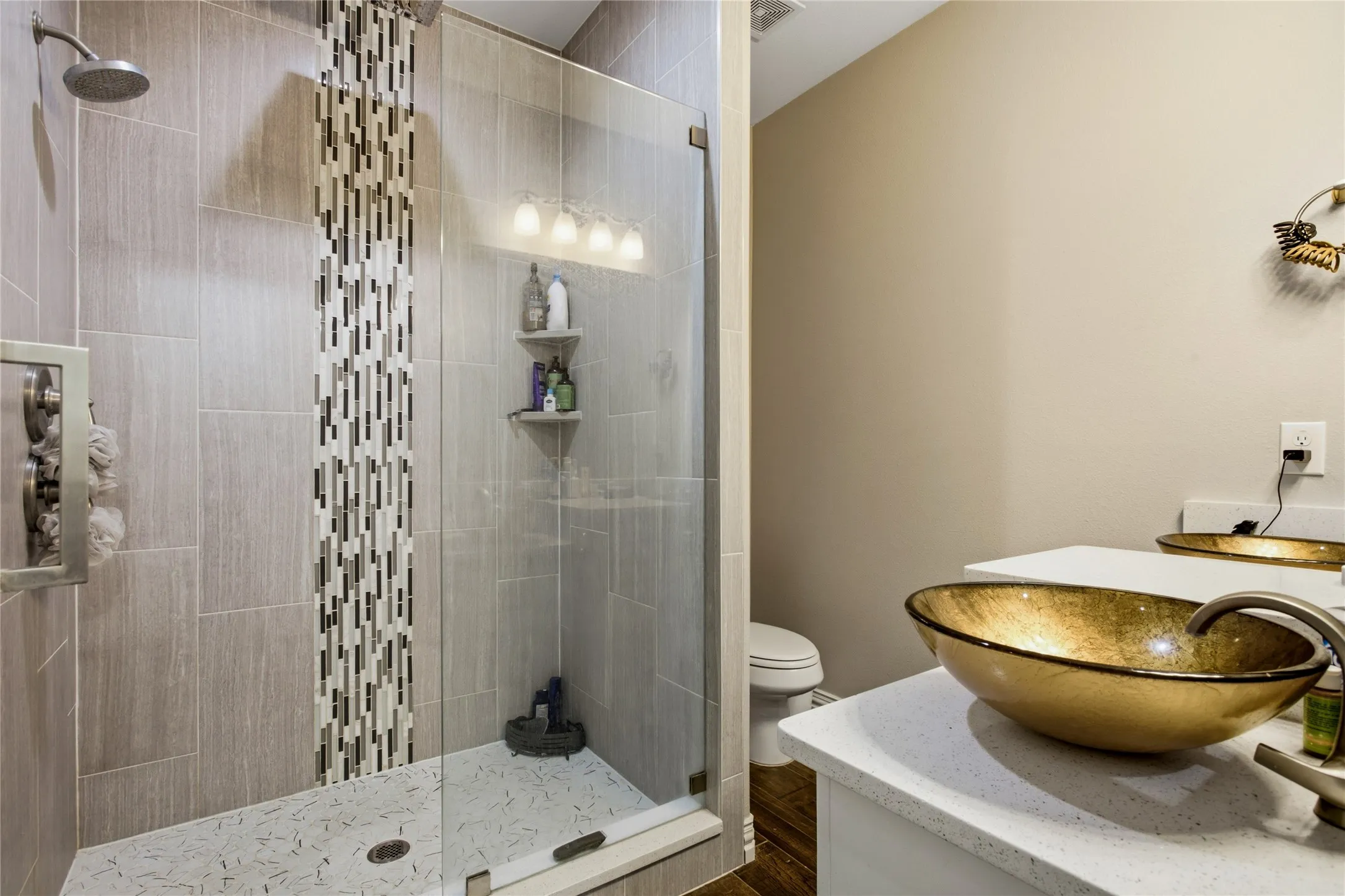 Thoughtfully designed spacious primary shower.