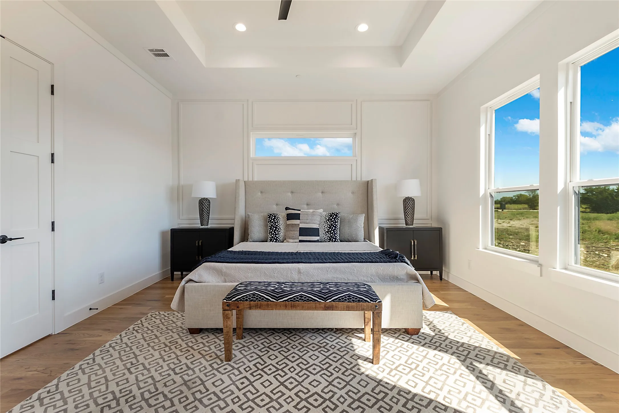 Tray ceiling with recessed lighting and a ceiling fan