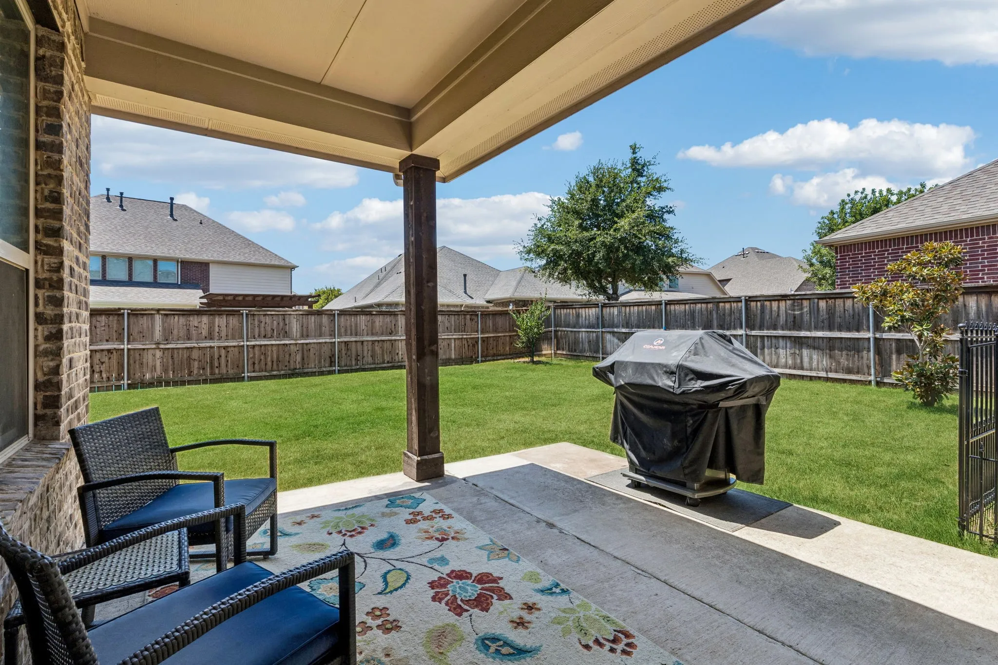 Covered patio perfect for enjoying an evening outside