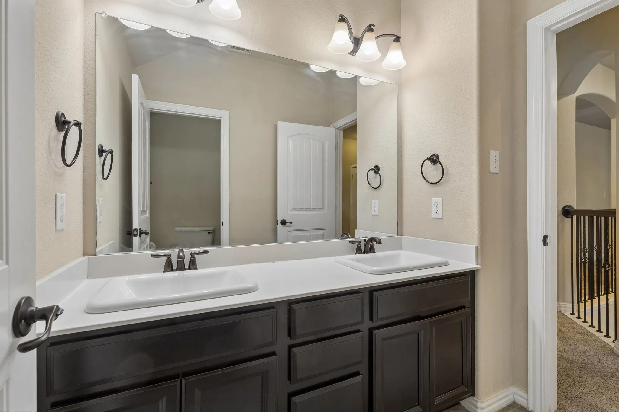 Full bathroom upstairs with 2 sinks and a separate room for the toilet and tub-shower combo