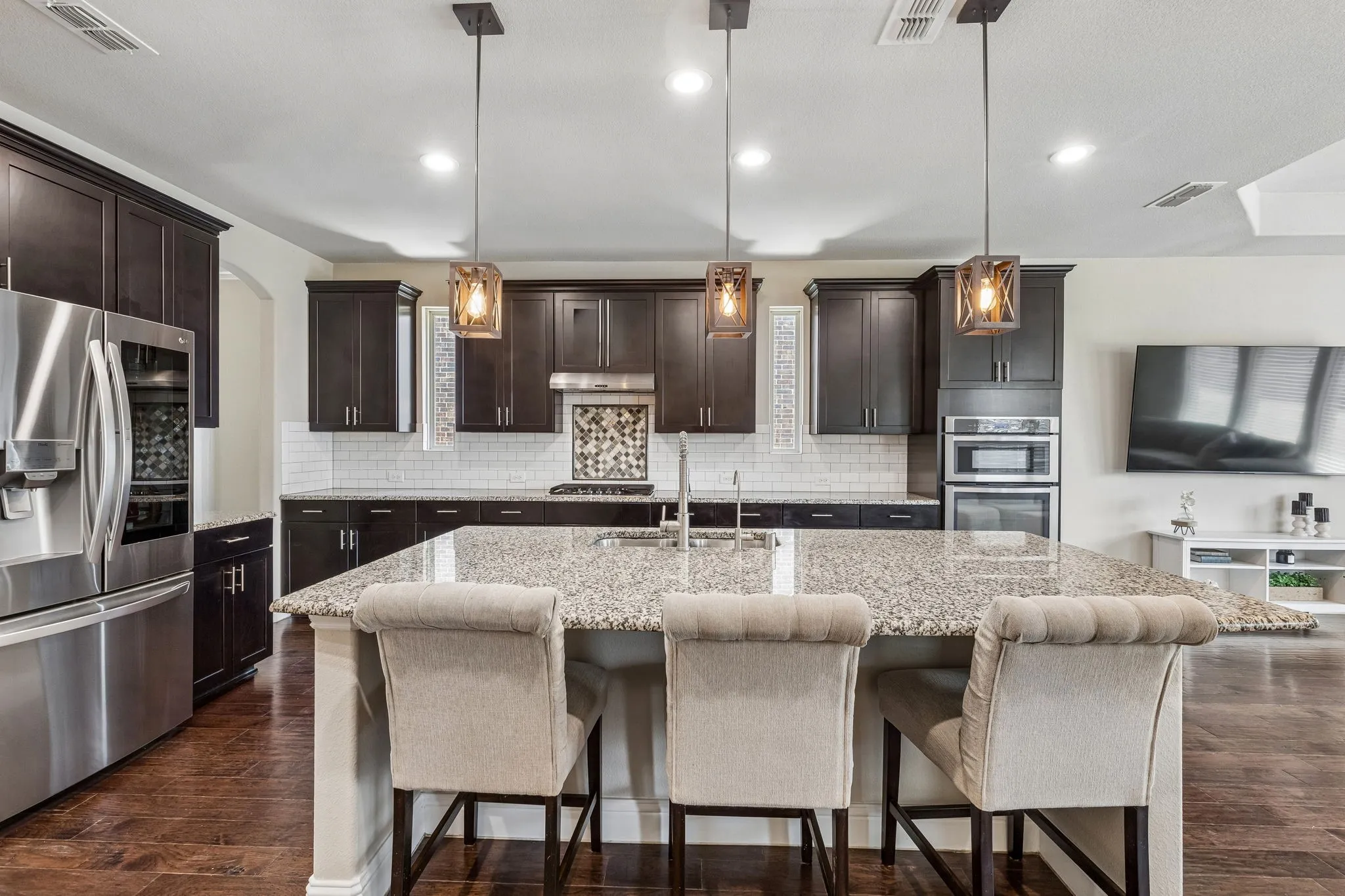 Kitchen featuring a large island with pendant lighting