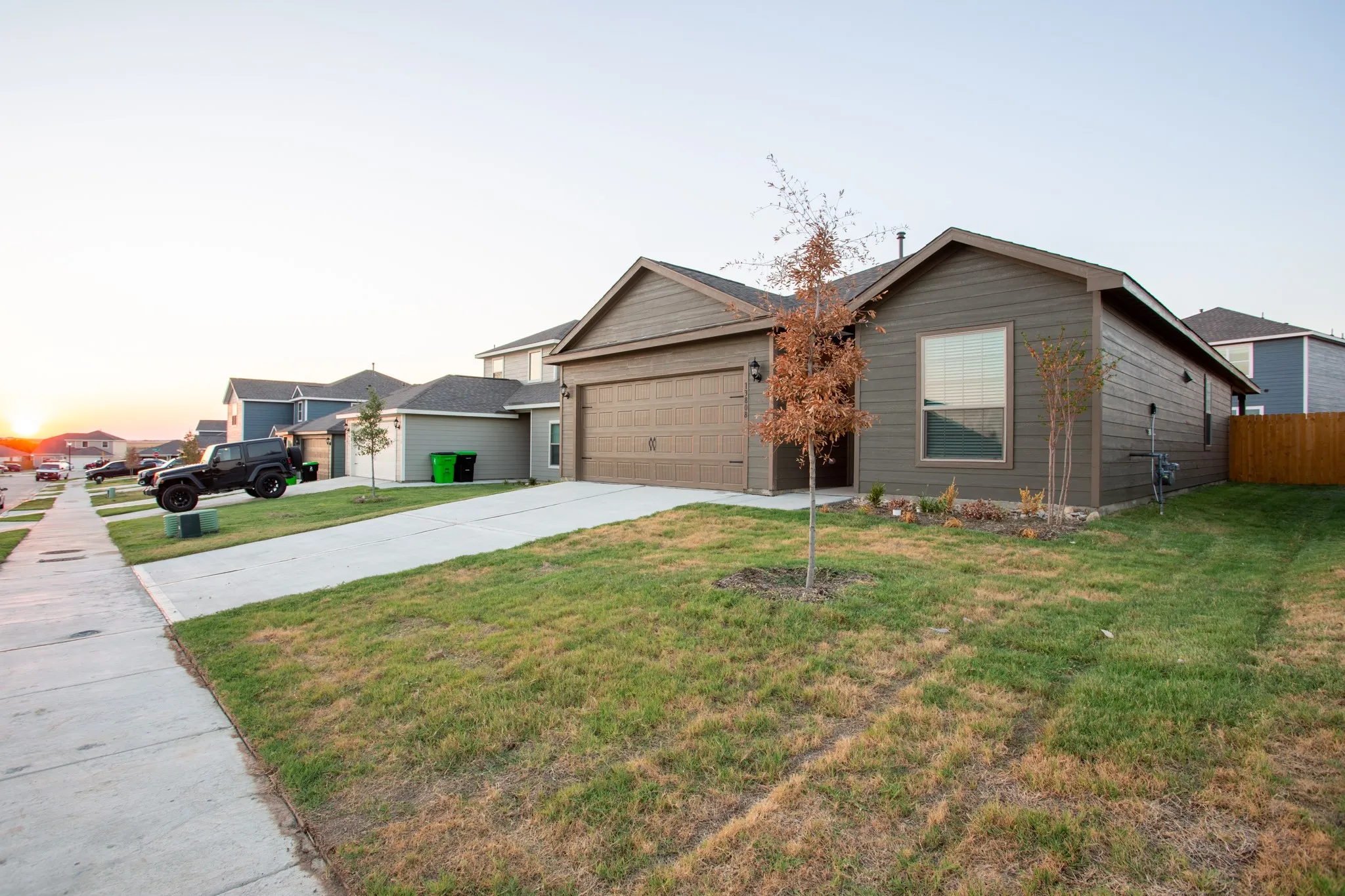 Single-story residence featuring horizontal siding and an attached two-car garage