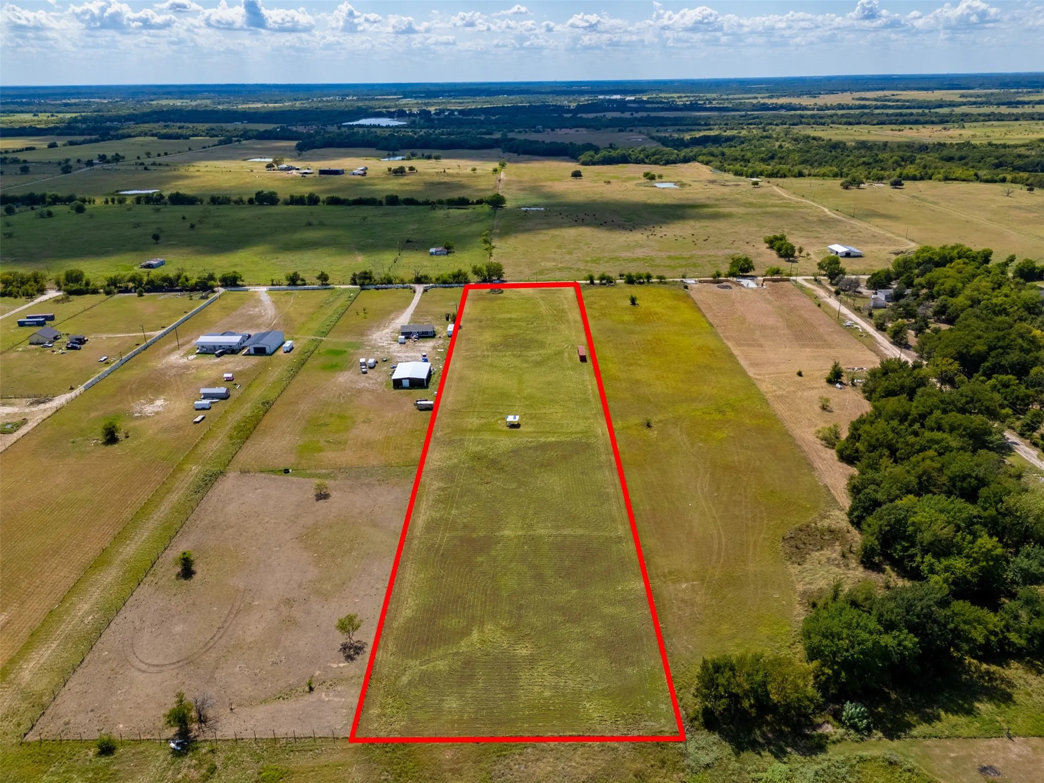 Expansive land parcel with open fields