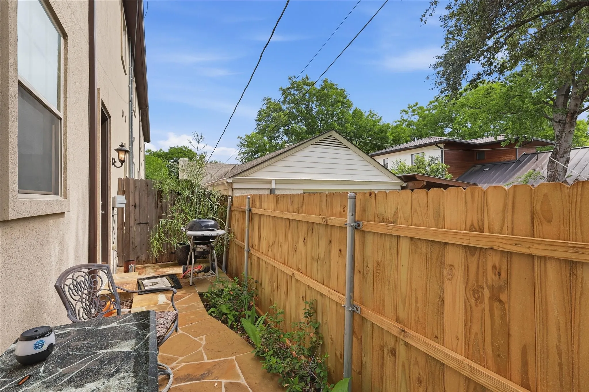 The perfect back and side yard is easily accessed through the mudroom area