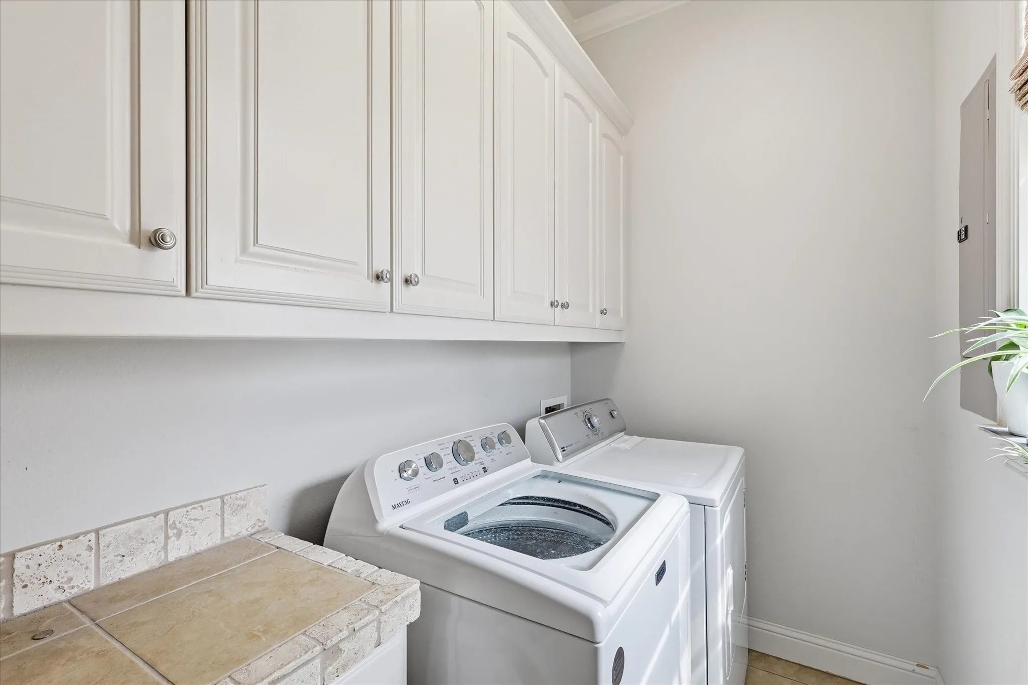 The laundry room and utility room have room for a full size washer and dryer, as well as cleaning supplies and other equipment