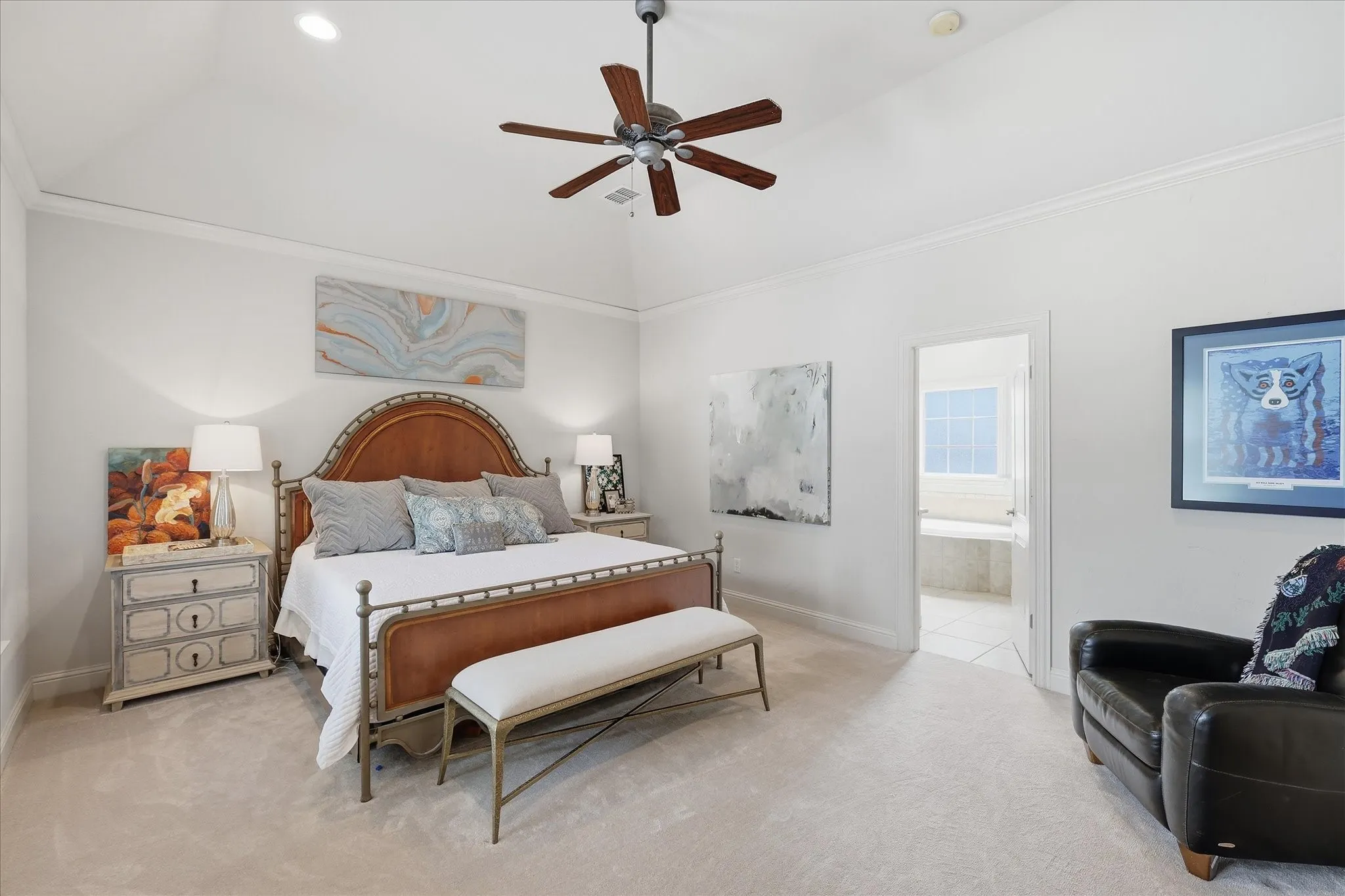 The spacious primary bedroom with ensuite bath