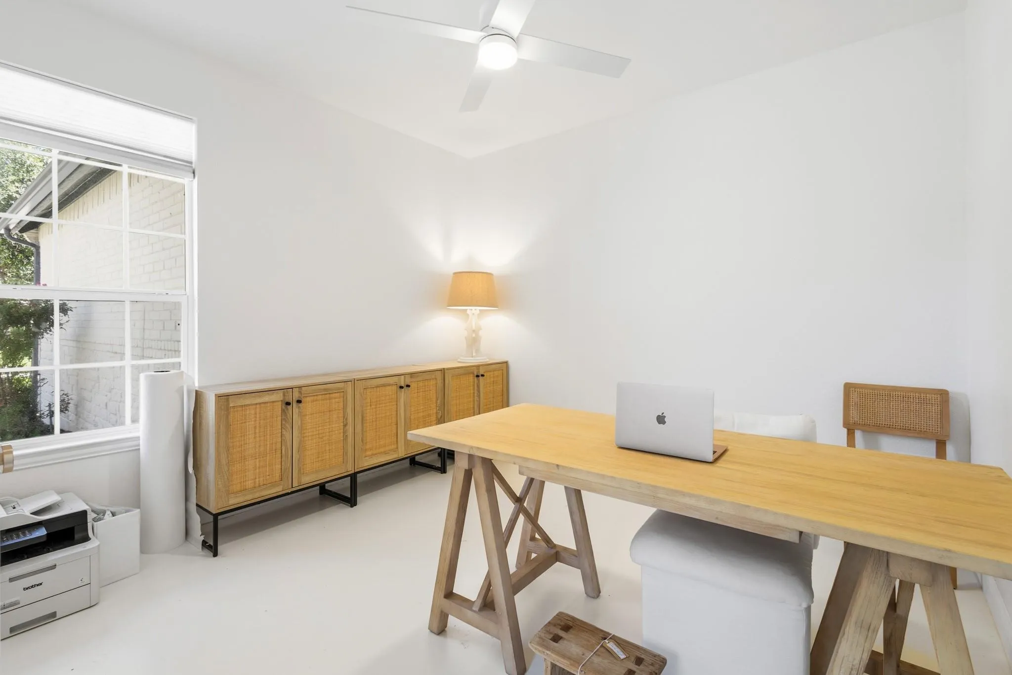 Recessed lighting, ceiling fan, white walls, and a large window with blinds