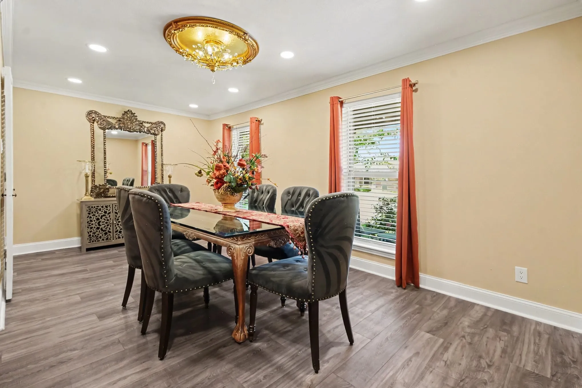 Recessed lighting, wood-finish flooring, crown molding, and a decorative ceiling medallion
