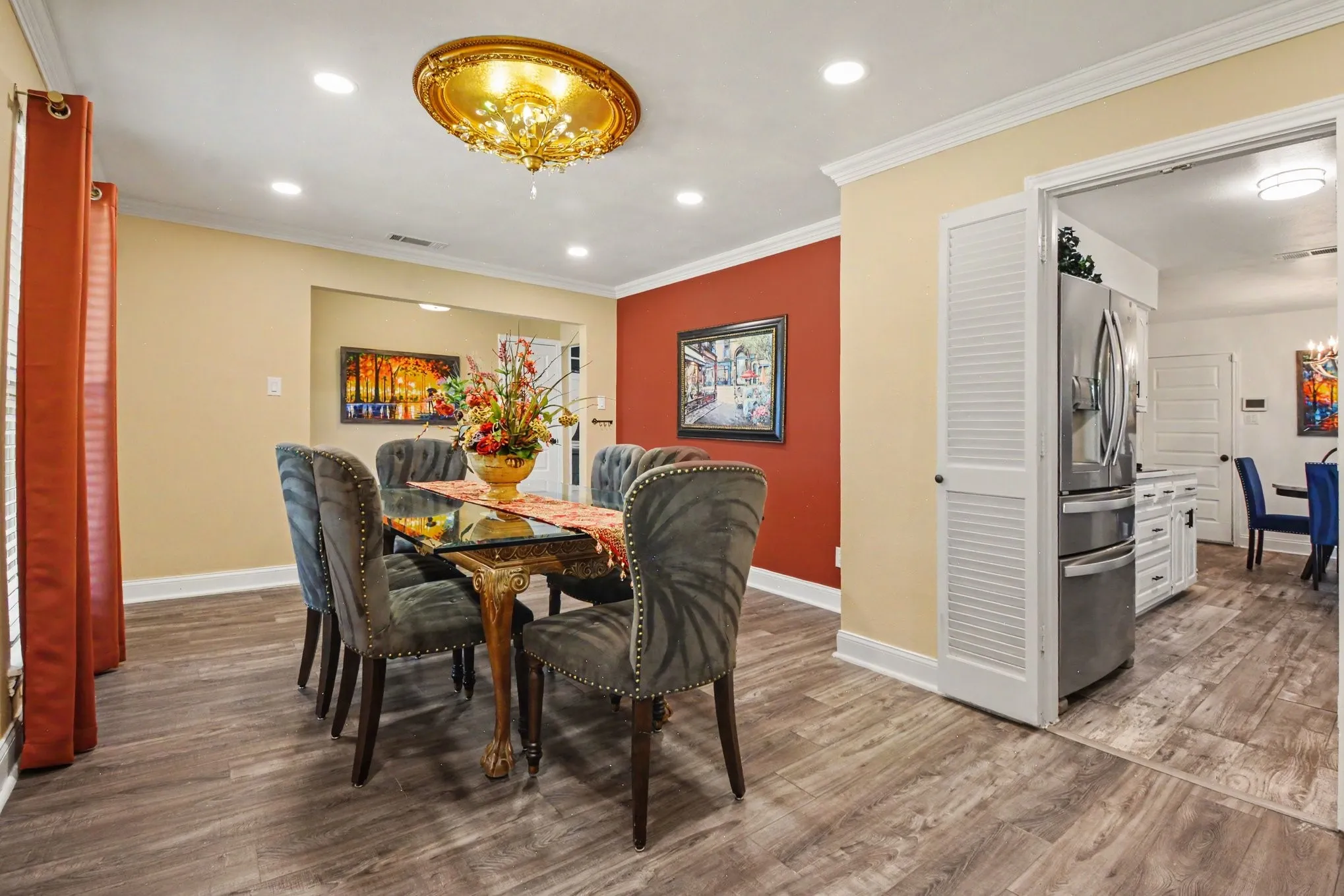 Recessed lighting with a decorative ceiling medallion, wood-finish flooring, and white crown molding