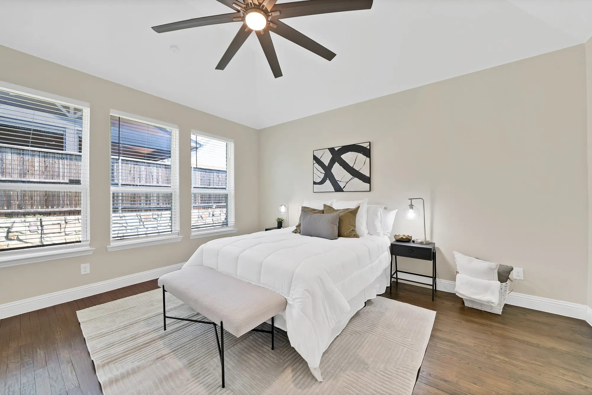 Recessed lighting, dark wood-finish flooring, three windows with blinds, and a ceiling fan