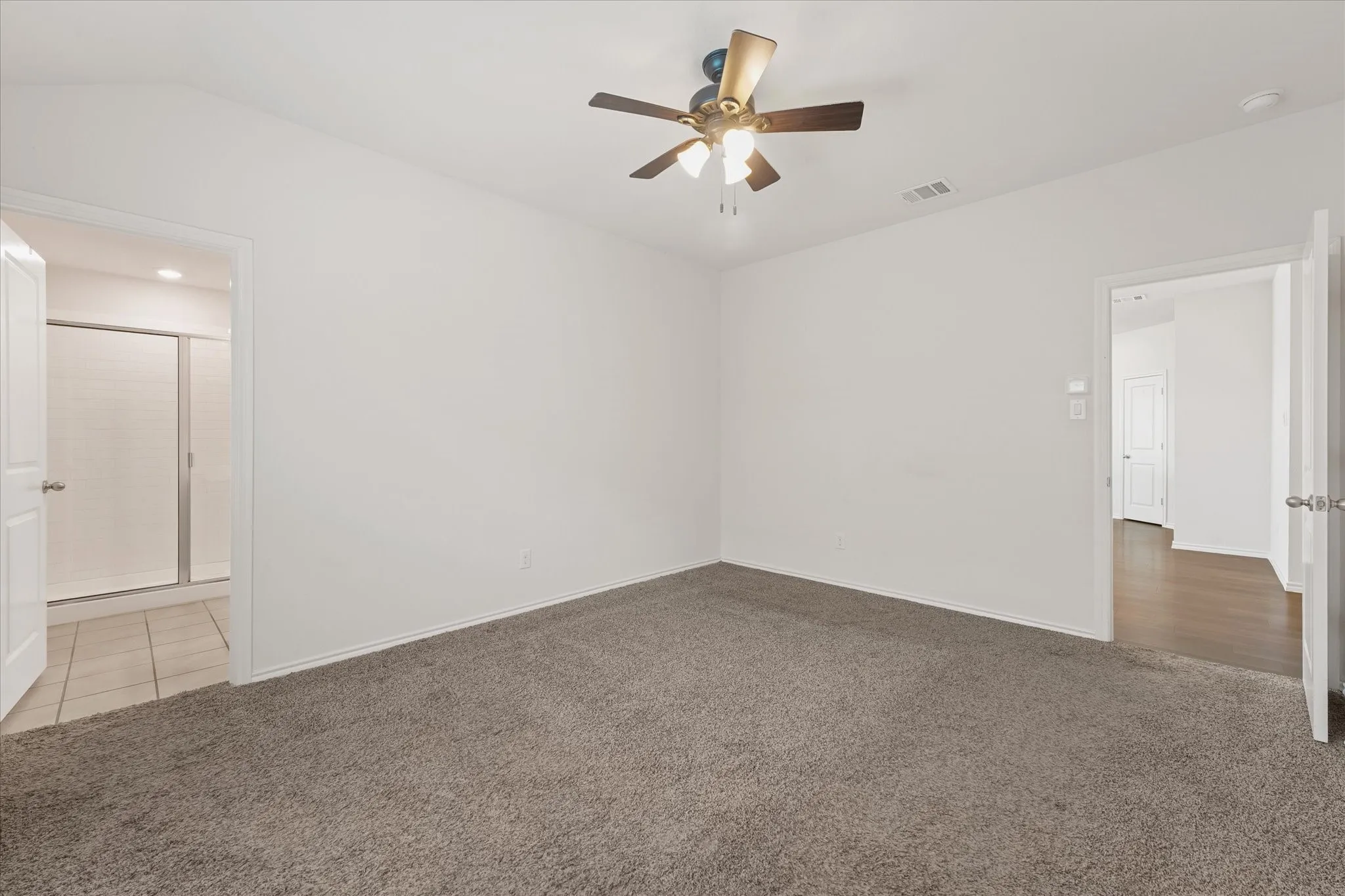 Another view of the primary bedroom