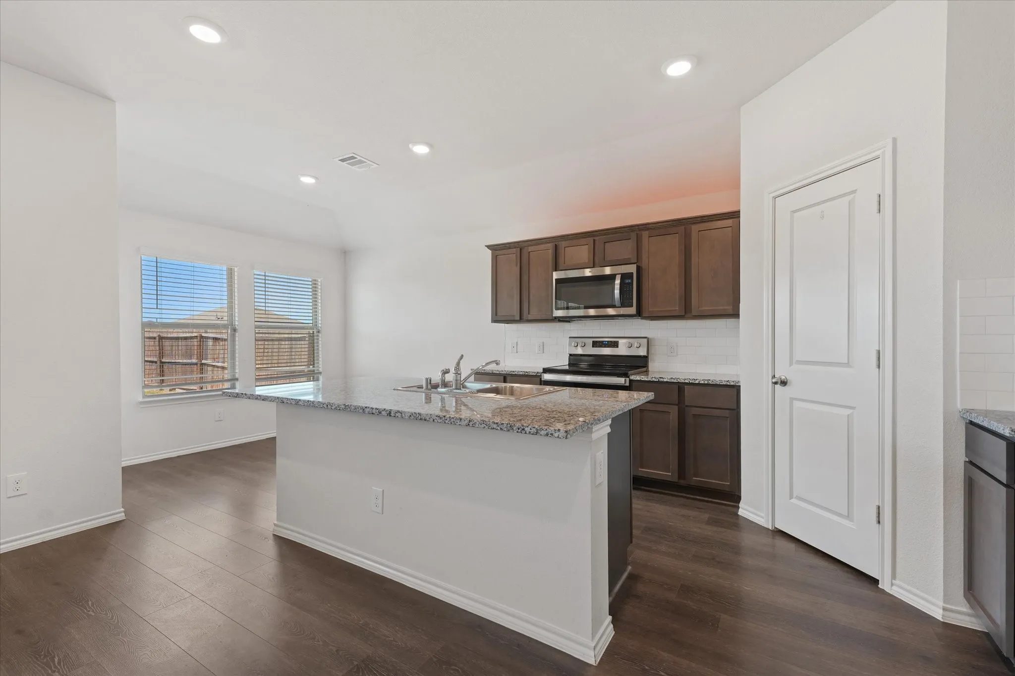 The kitchen as plenty of counter space and a pantry for extra storage.
