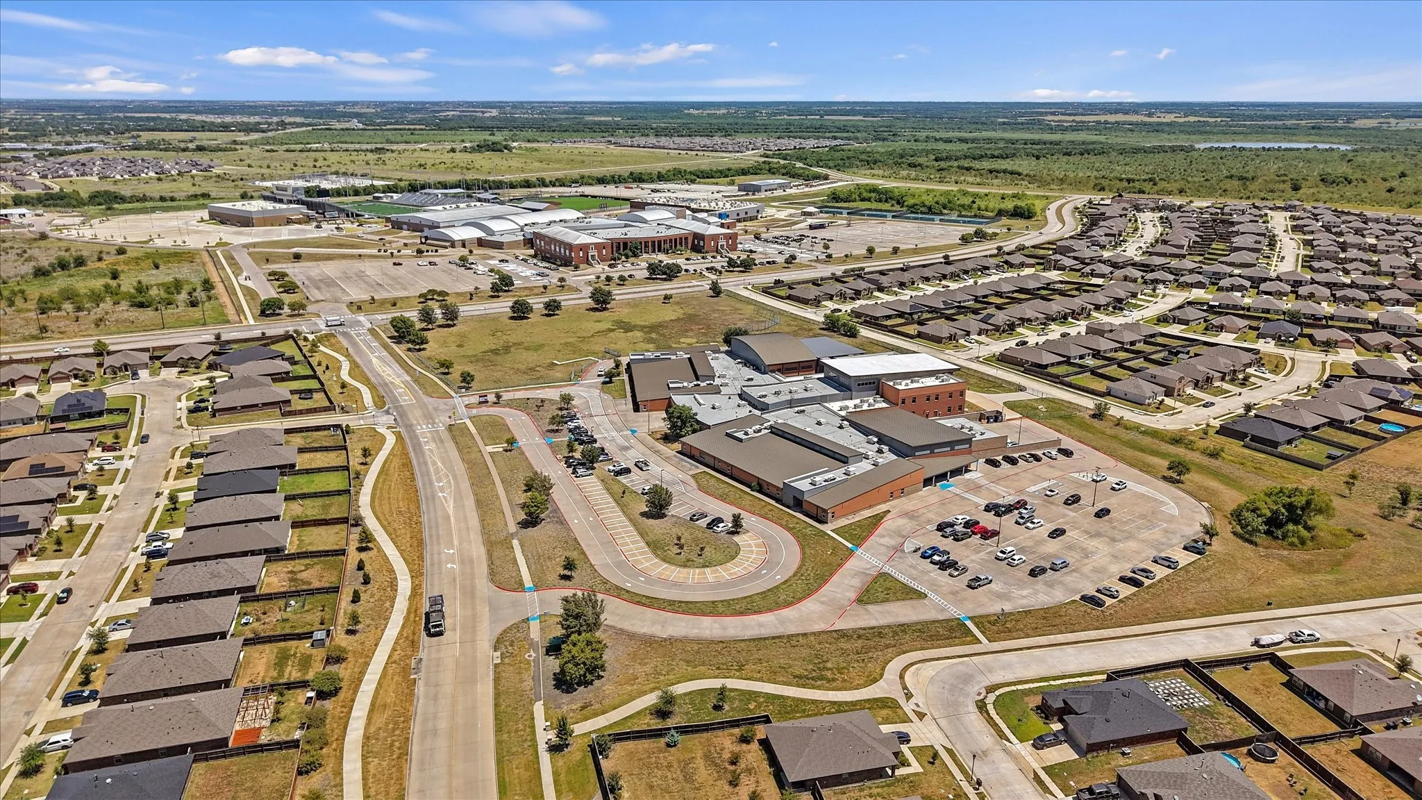 Aerial view of the neighborhood and a Forney ISD school