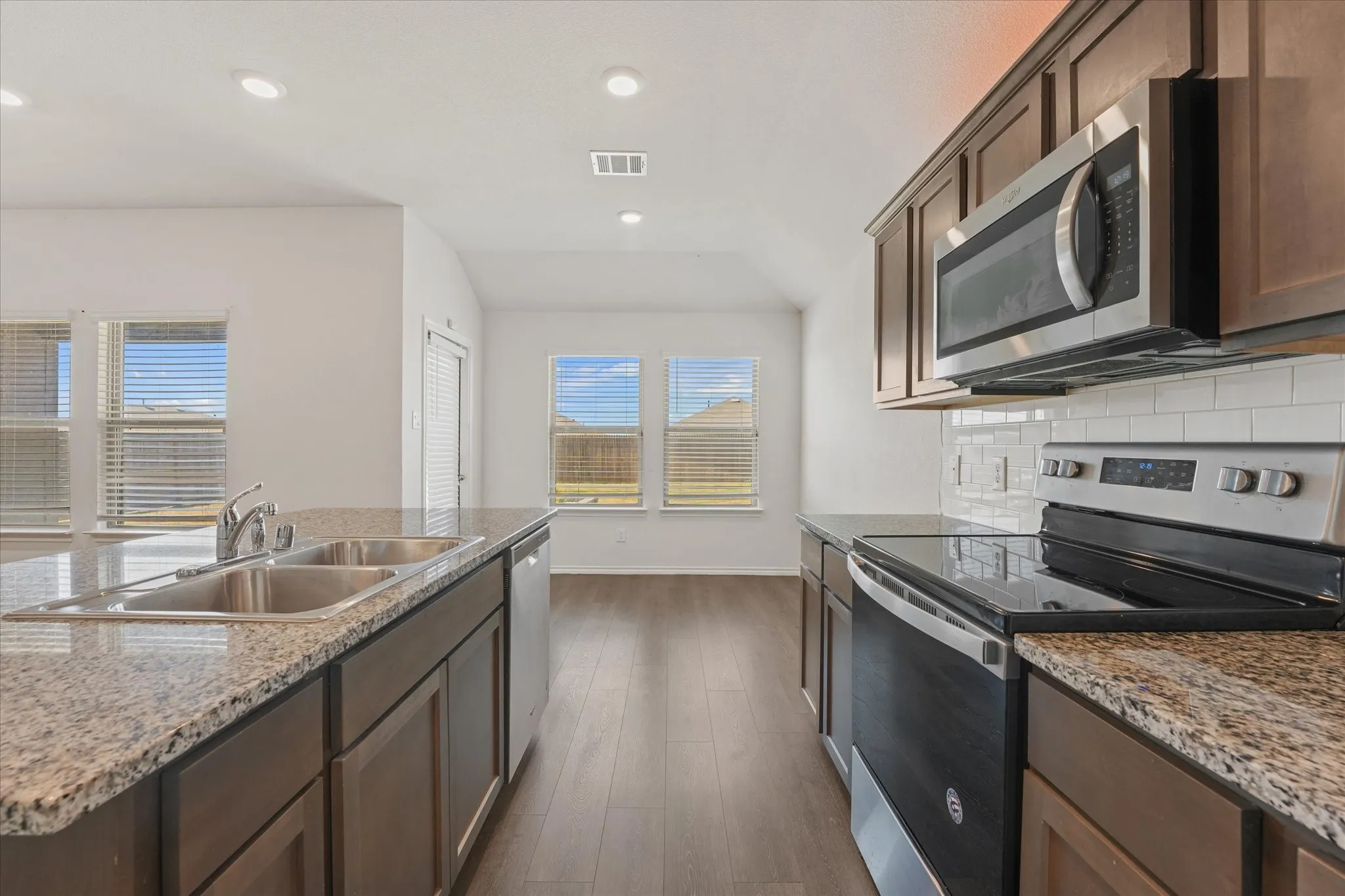 Here you can see the stainless steel appliances including the smooth top electric range.