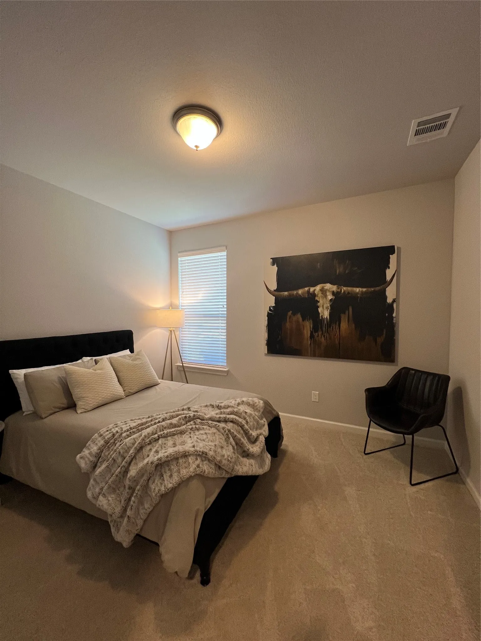 Bedroom with carpet floors and baseboards
