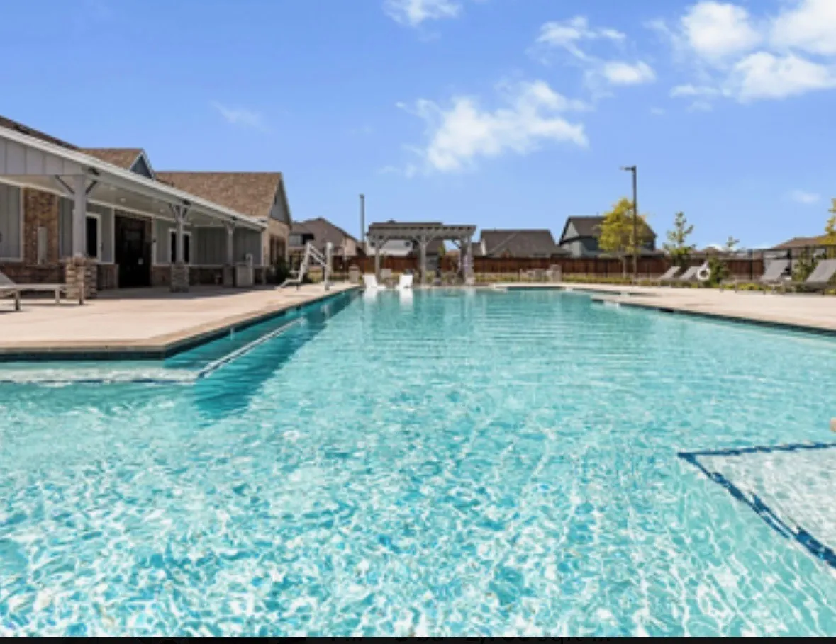Community pool featuring a patio area