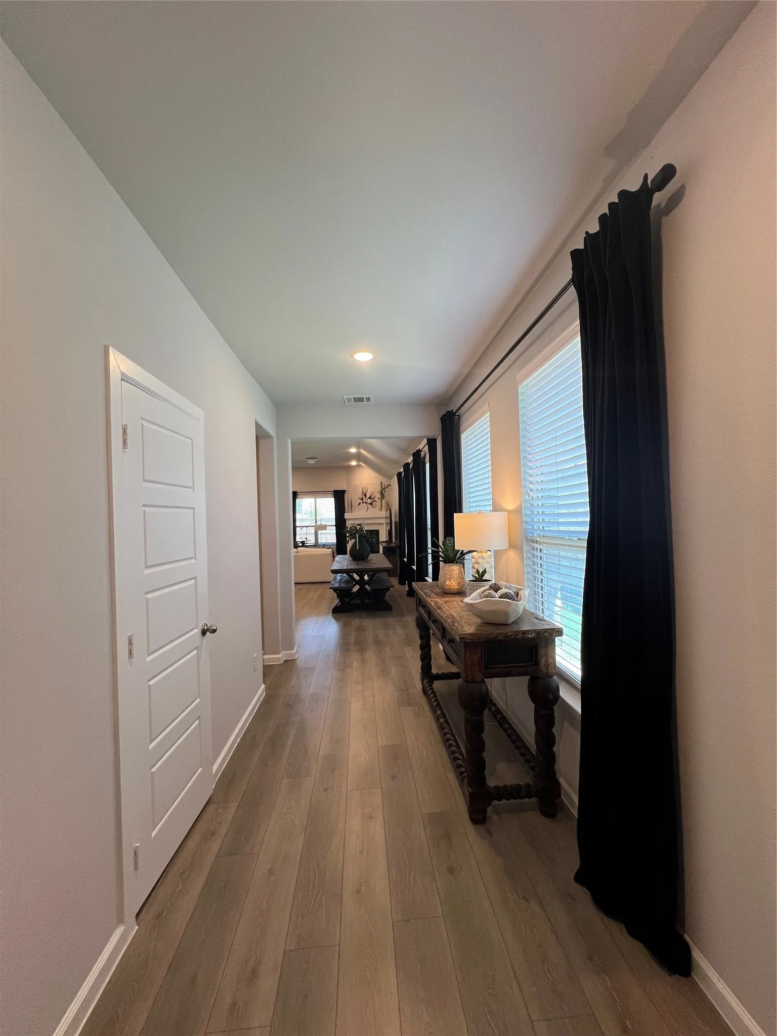 Hallway with wood finished floors