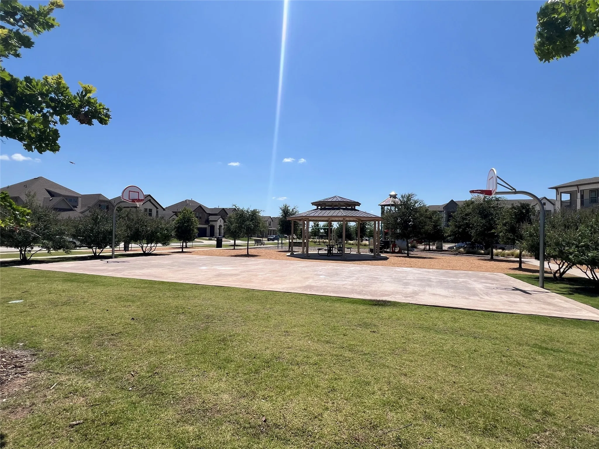 View of sport court with a gazebo, a yard, and community basketball court