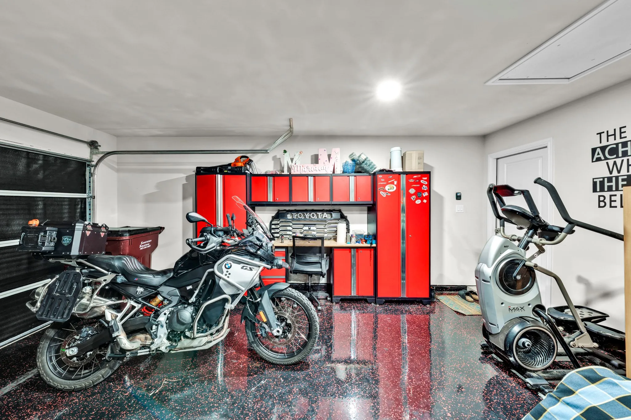 Garage featuring an epoxy coated floor