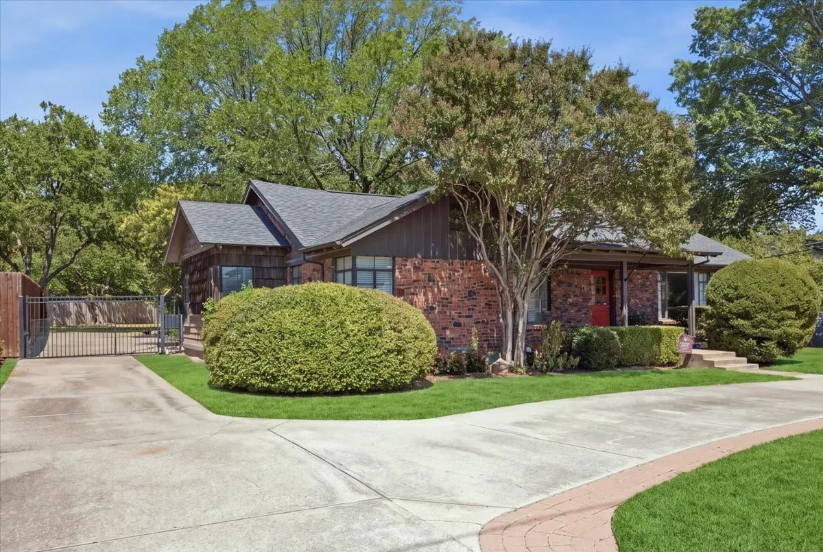 Clinker Brick exterior with dark trim and a gabled roof
