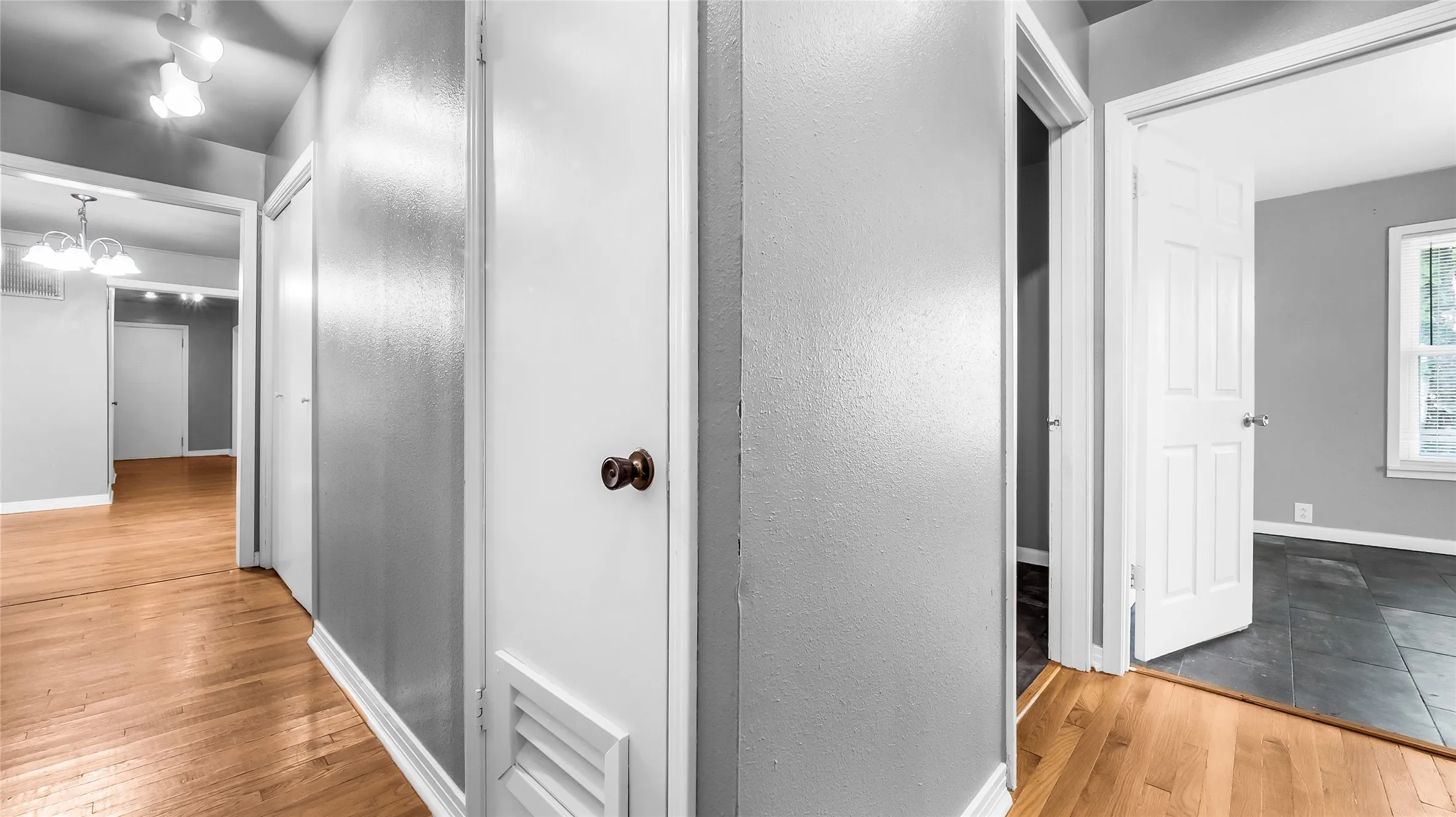 Wood-finish flooring throughout the hallway