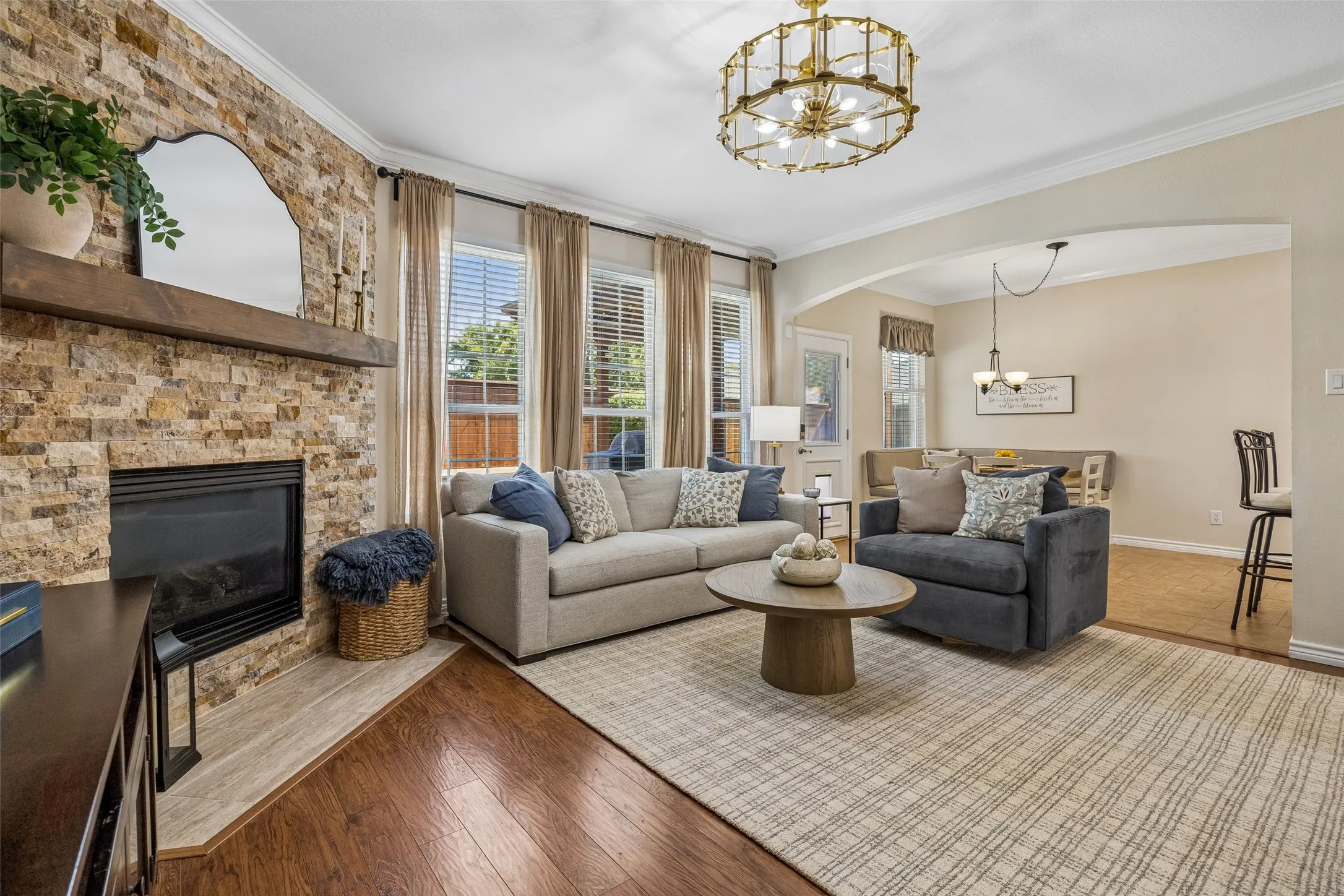 Main Living Spaces That Work Together - The family room opens naturally toward the breakfast area and kitchen, creating a practical layout for conversation, entertaining, and daily routines without losing definition between spaces.