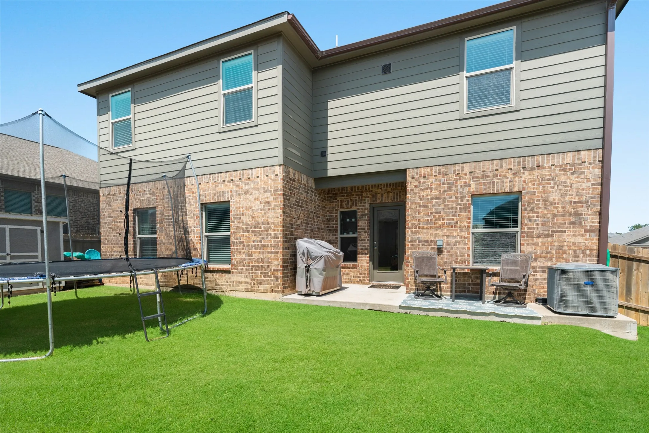 Brick and siding exterior with multiple windows