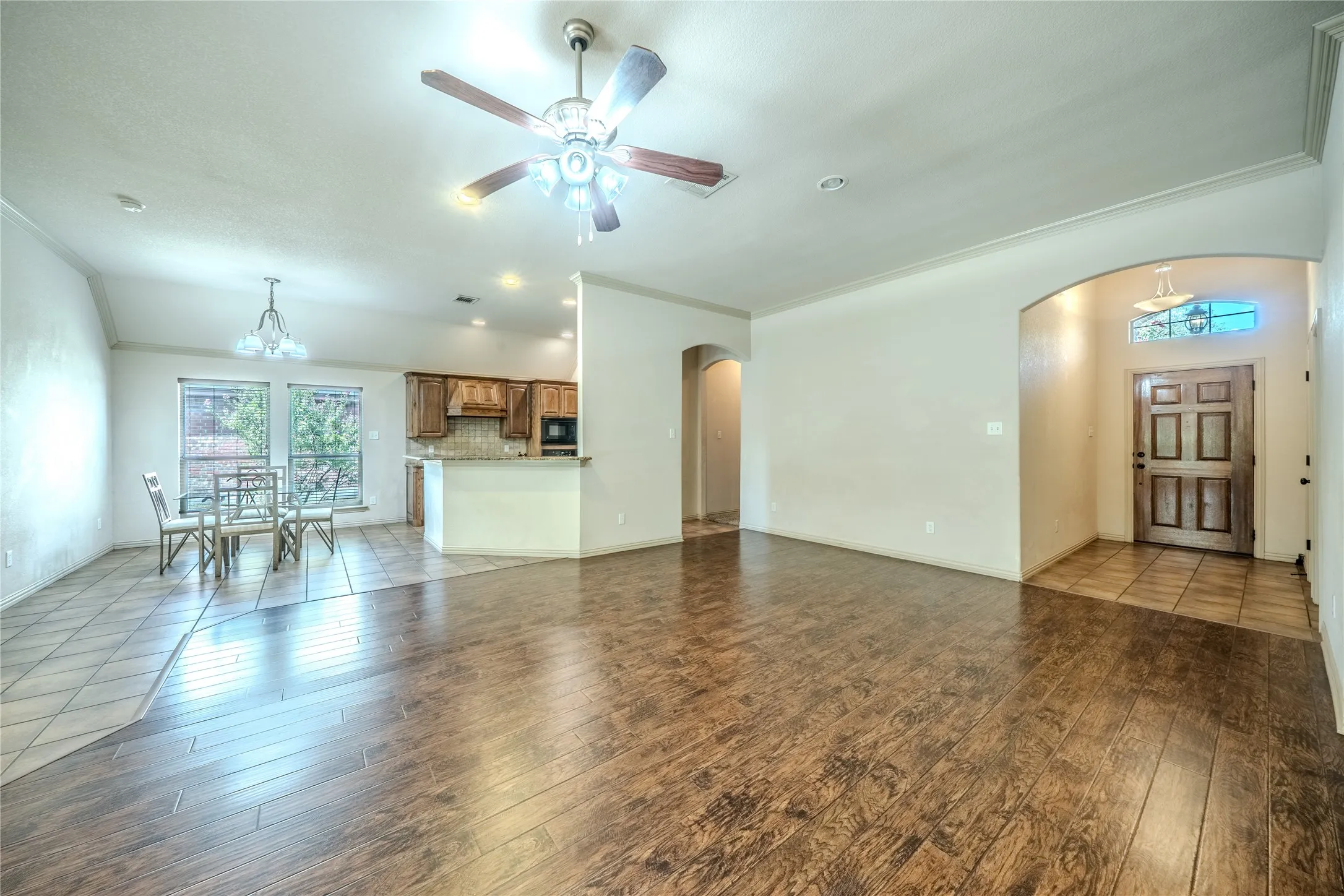Open floor plan showing entry hall, dining and kitchen.