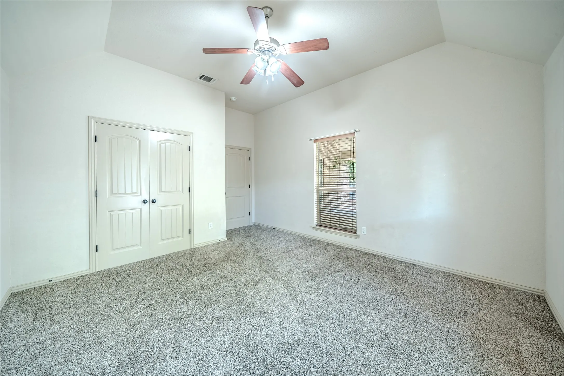 High ceilings and ceiling fan.