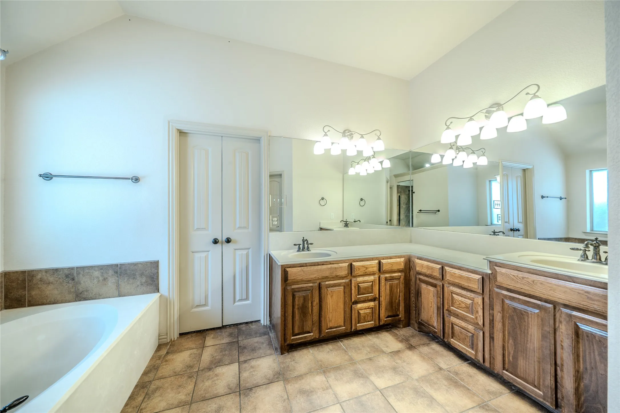 En suite bath with double sinks .
